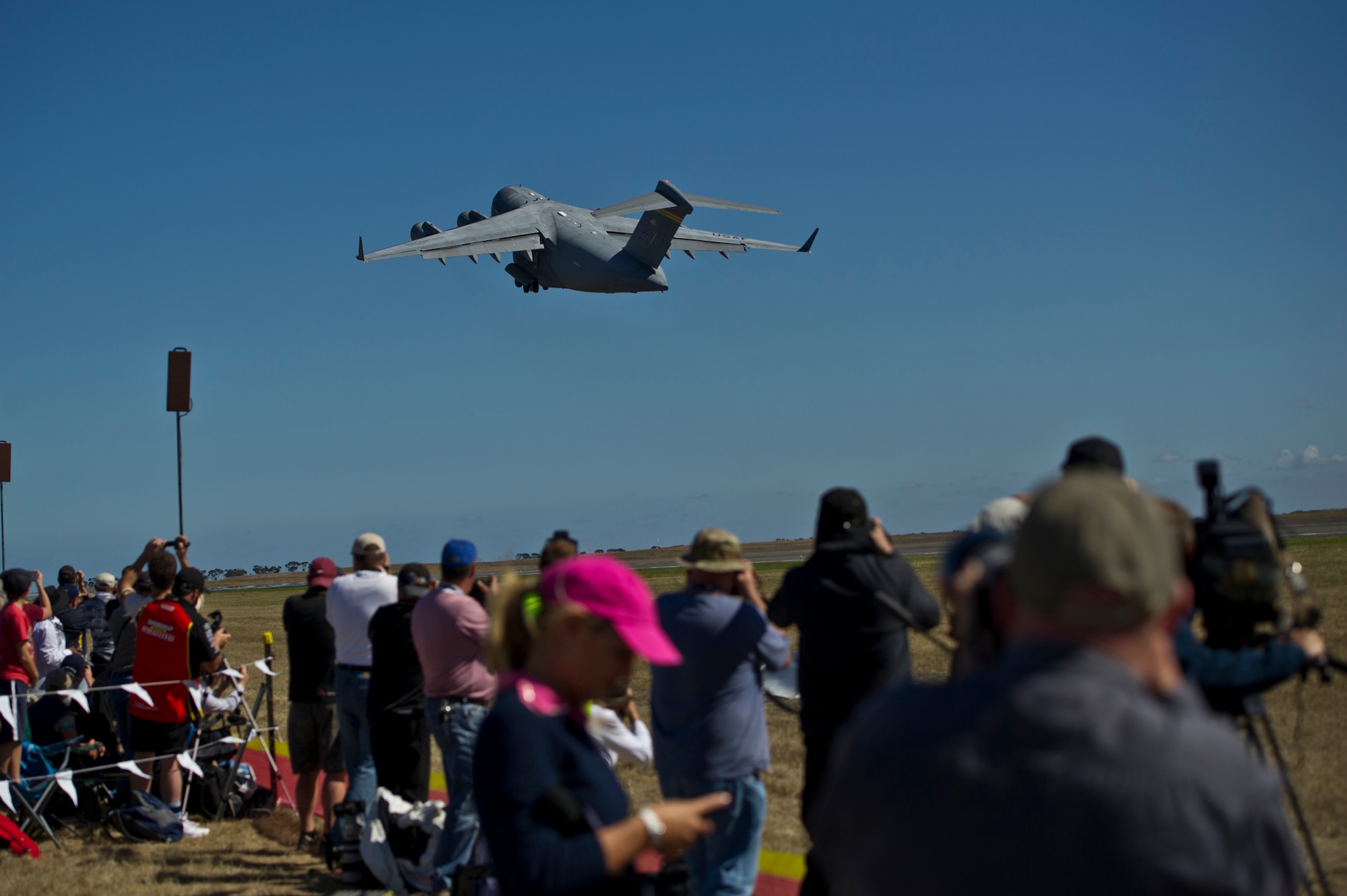 A U.S. Air Force C-17 Globemaster III from the Pacific Air Forces (PACAF) Demonstration Team takes off to perform an aerial demonstration for an estimated 180,000 spectators at the Australian International Airshow, March 1, 2013 at Avalon Airport in Geelong, Australia. The PACAF C-17 demo team is part of the 535th Airlift Squadron and is based out of Joint Base Pearl Harbor-Hickam, Hawaii.  The Australian International Airshow 2013 (AIA13), is held biennially, and is one of the largest international trade shows in the Pacific. The Airshow is expected to draw 350,000 visitors and has featured 500 defense exhibitors from 35 countries and is designed to bolster business opportunities in the international aviation sector. U.S. Pacific Command (USPACOM) participation in AIA13 directly supports theater engagement goals and objectives and further enhances relationships with other Pacific nations. (Department of Defense photo by U.S. Air Force Tech. Sgt. Michael R. Holzworth/Released)