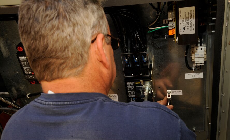 Ray O'Briant, 2nd Civil Engineer Squadron Heating, Ventilation, Air Conditioning, and Refrigeration, modifies the power supply of a newly installed chiller on Barksdale Air Force Base, La., March 1. The previous chiller was an older model, so when the new chiller was installed, modifications to the power and pipe system had to be done in order for it to function properly. (U.S. Air Force photo/Airman 1st Class Andrew Moua)