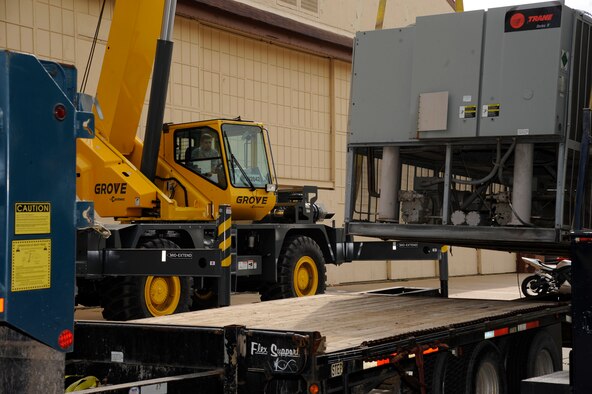 Staff Sgt. Kyle Pullum, 2nd Civil Engineer Squadron Heavy Repair, operates a crane and moves a chiller in preparation for installation on Barksdale Air Force Base, La., March 1. The heavy repair section, also known as the "Dirt Boys," have the responsibilities of maintaining and setting up Barksdale's infrastructure ranging from roads and pavement, construction projects and maintaining Barksdale's flightline. (U.S. Air Force photo/Airman 1st Class Andrew Moua)