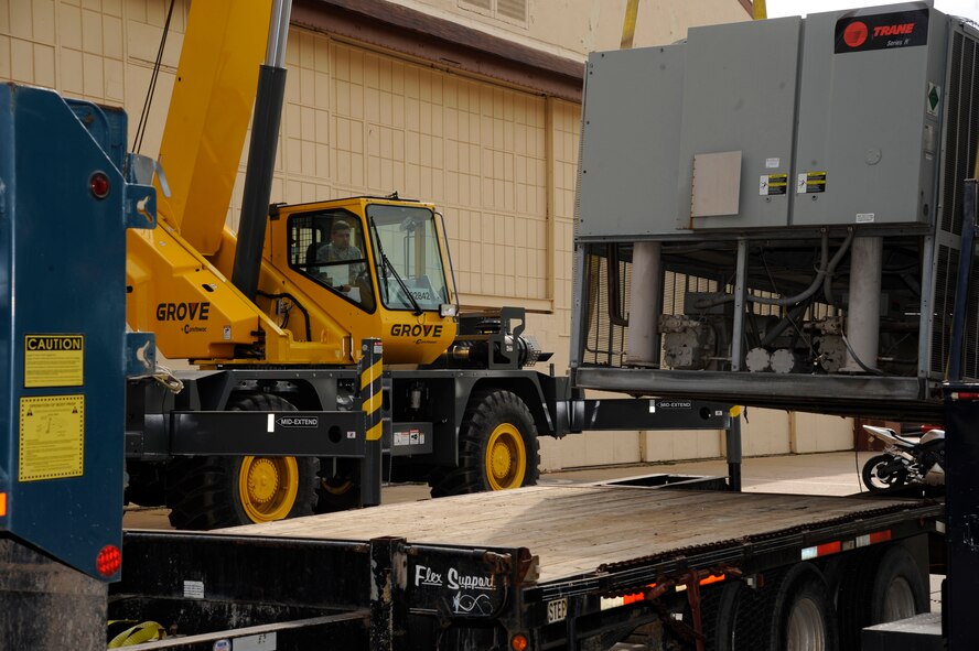 Staff Sgt. Kyle Pullum, 2nd Civil Engineer Squadron Heavy Repair, operates a crane and moves a chiller in preparation for installation on Barksdale Air Force Base, La., March 1. The heavy repair section, also known as the "Dirt Boys," have the responsibilities of maintaining and setting up Barksdale's infrastructure ranging from roads and pavement, construction projects and maintaining Barksdale's flightline. (U.S. Air Force photo/Airman 1st Class Andrew Moua)