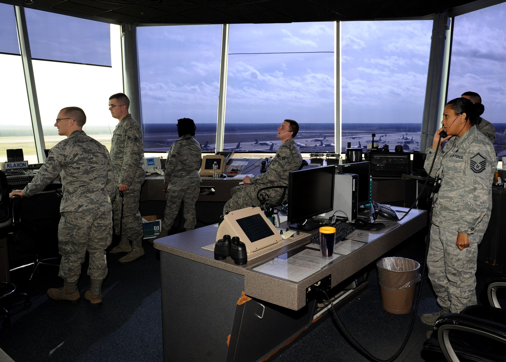 Air Traffic Controllers from the 2nd Operations Support Squadron monitor flightline operations on Barksdale Air Force Base, La., March 4. ATCs have multiple responsibilities which include watching for birds near taxiing planes and keeping the aircrew up to date on flightline conditions and giving them clearance to take-off. (U.S. Air Force photo/Airman 1st Class Benjamin Gonsier)
