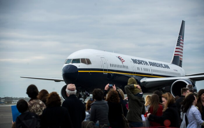 A commercial plane carrying members of the 14th Airlift Squadron taxis towards the passenger terminal during the 14th AS re-deployment March 3, 2013, at Joint Base Charleston - Air Base, S.C. More than 100 Airmen from the 14th AS returned home from a 120-day deployment to Southwest Asia. (U.S. Air Force photo/ Senior Airman George Goslin)