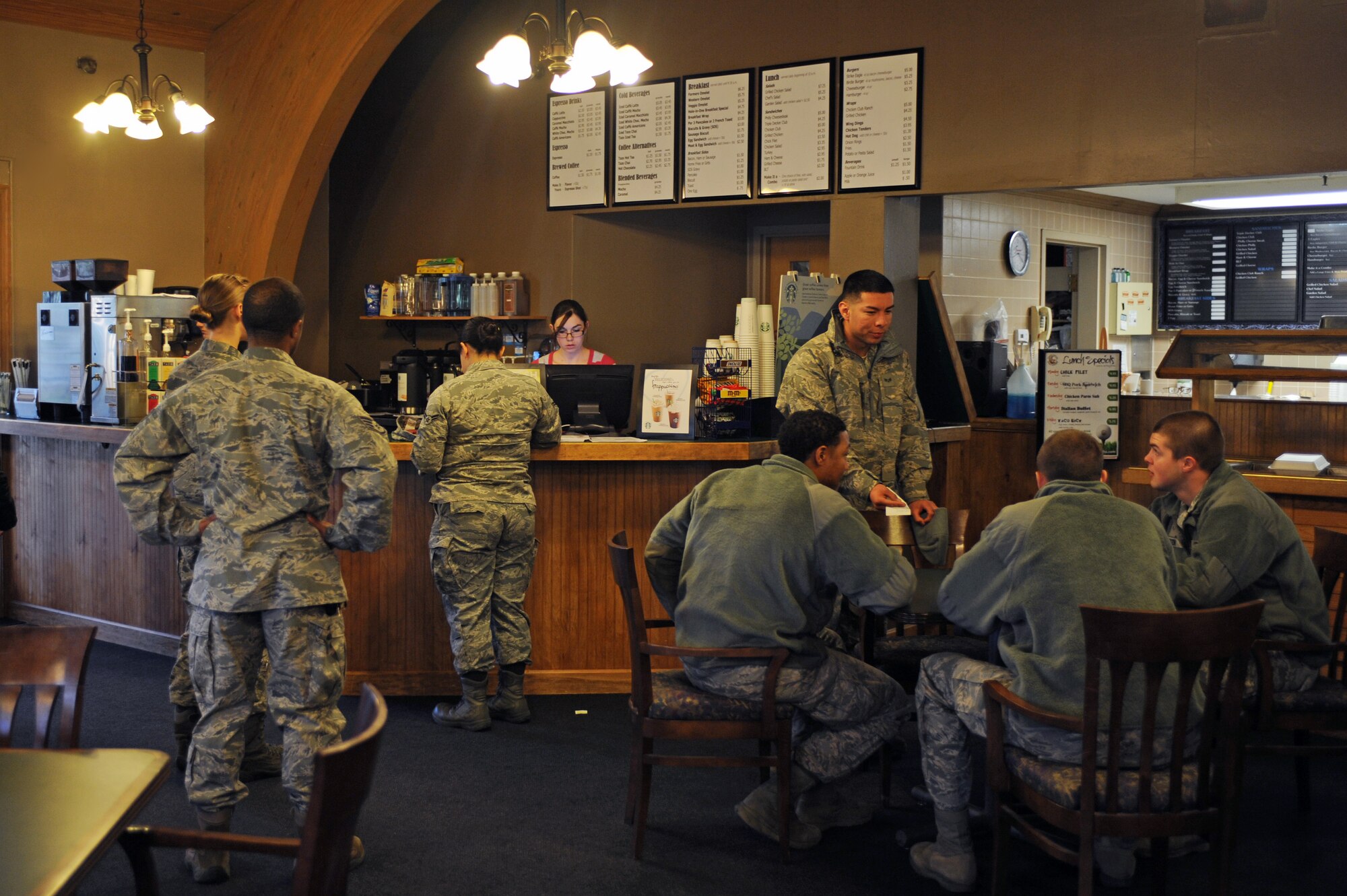 U.S. Air Force Airmen assigned to the 4th Fighter Wing sip coffee and converse at the newly opened Starbucks located in the Three Eagles Café on Seymour Johnson Air Force Base, N.C., Mar. 1, 2013. Starbucks is open Monday through Friday from 6:30 a.m. to4:30 p.m., and Saturday and Sunday from 6:30 a.m. to 2 p.m. (U.S. Air Force photo/Airman 1st Class John Nieves Camacho/Released)