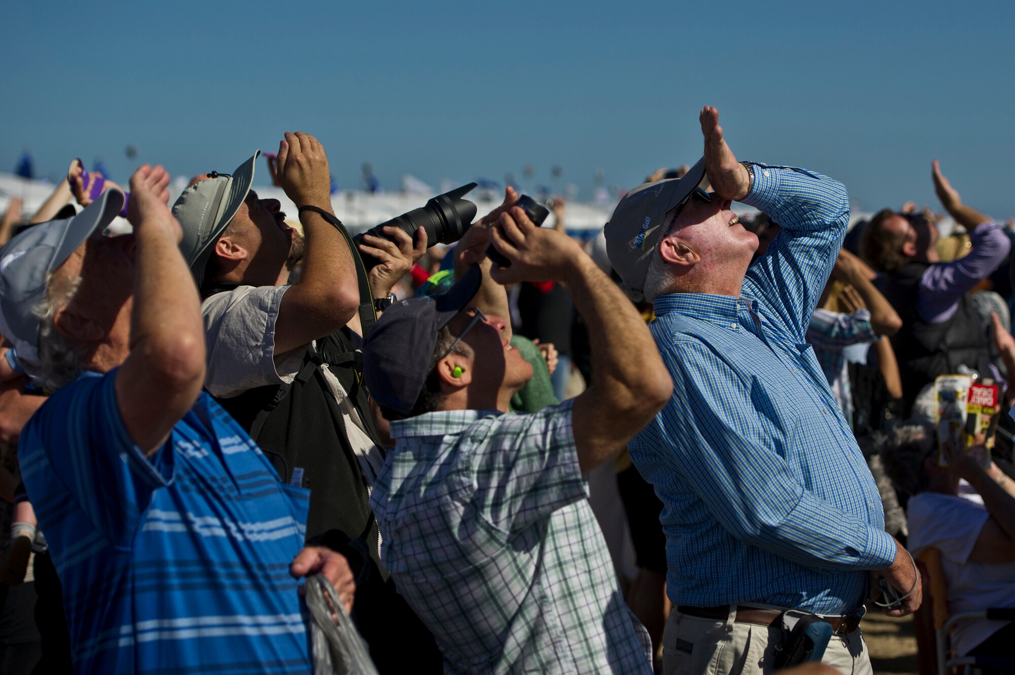 Spectators at the Australian International Airshow, look skyward to witness the inaugural U.S. Air Force F-22 Raptor aerial demonstration  in the Pacific March 1, 2013 at Avalon Airport in Geelong, Australia. Approximately 220 U.S. service members along with the U.S. Air Force's F-22 Raptor, C-17 Globemaster III, F-16 Fighting Falcon, B-52 Stratofortress, and KC-135 Stratotanker are supporting the Australian International Airshow 2013, which allows a unique opportunity for the United States to showcase its aviation prowess and strengthen military-to-military ties with our Pacific allies and partners. (Department of Defense photo by U.S. Air Force Tech.Sgt.MichaelR.Holzworth/Released)

