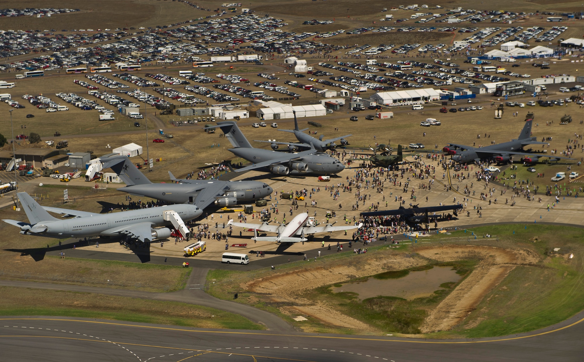Two U.S. Air Force F-22 Raptors, Two F-16 Fighting Falcons, a KC-135 Stratotanker, a B-52 Stratofortress, and a C-17 Globemaster III, all currently assigned to U.S. Pacific Air Forces join with Australian military aircraft and civilian aircraft from around the world for display on the tarmac at Avalon Airport in Geelong, Australia for an estimated 180,000 spectators during the Australian International Airshow, March 2, 2013. Approximately 220 U.S. service members are supporting the Australian International Airshow 2013, which allows a unique opportunity for the United States to showcase its aviation prowess and strengthen military-to-military ties with our Pacific allies and partners. (Department of Defense photo by U.S. Air Force Tech.Sgt.MichaelR.Holzworth/Released)
