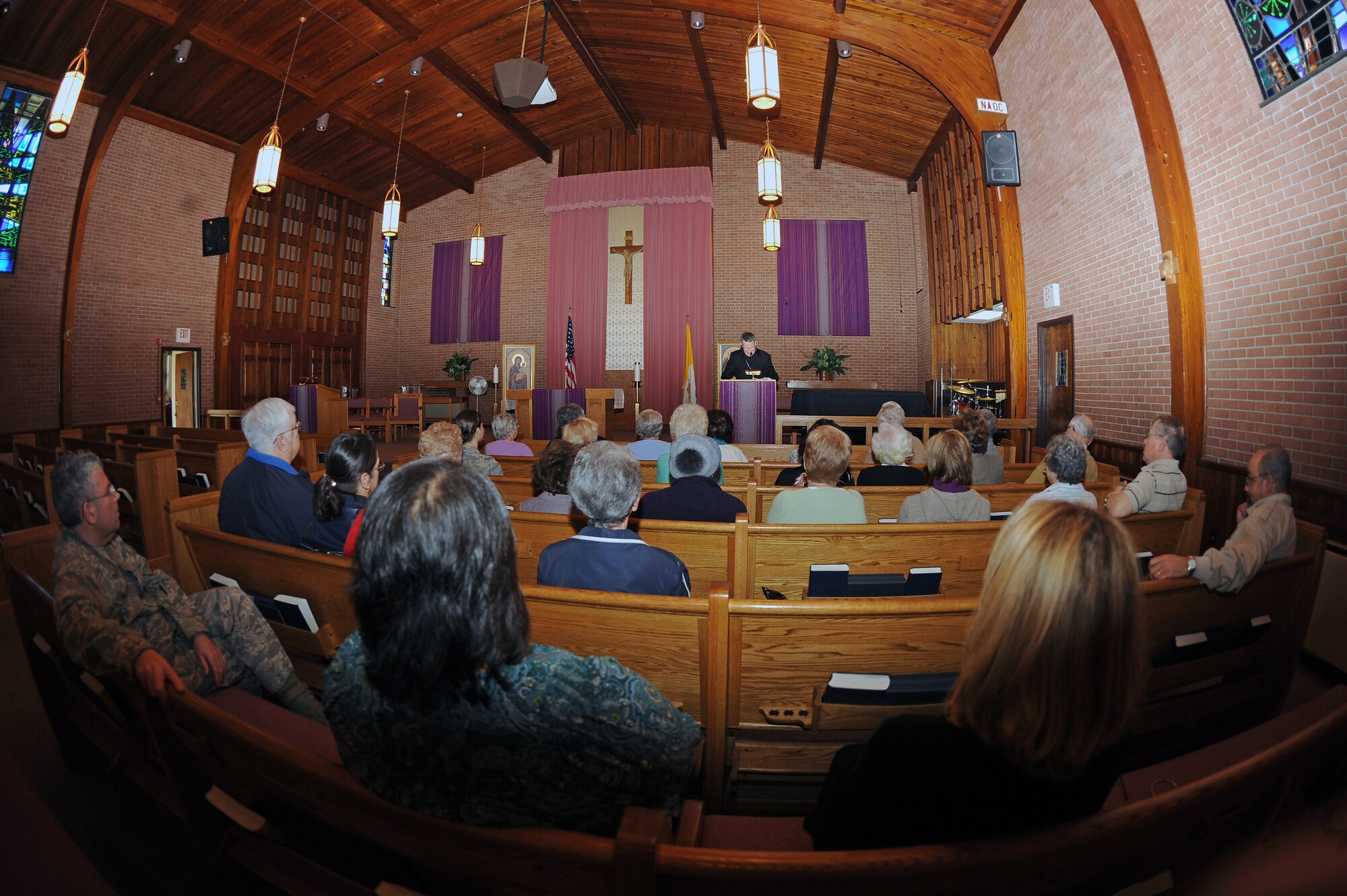 Members of the Catholic community listen to Timothy Broglio, Military Services archbishop, at the base chapel on Seymour Johnson Air Force Base, N.C., Feb. 27, 2013. The archbishop reviewed the significance and practicing of fasting, almsgiving and prayer with those attending. (U.S. Air Force photo/Airman 1st Class John Nieves Camacho/Released)