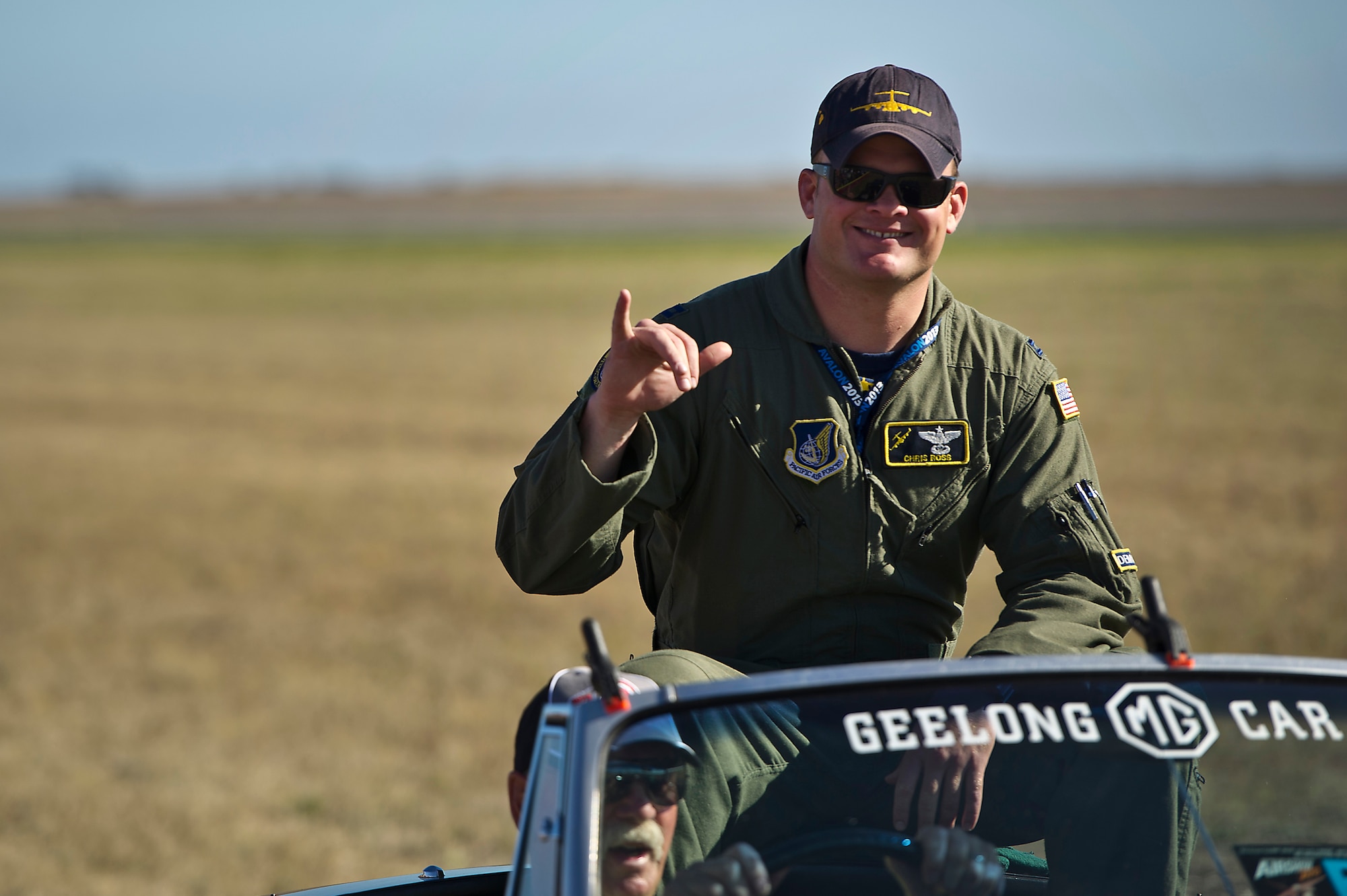 U.S. Air Force C-17 Globemaster III Pilot, Capt. Chriis Ross from the Pacific Air Forces (PACAF) Demonstration Team waves to the crowd after completing its aerial demonstration for an estimated 180,000 spectators at the Australian International Airshow, March 1, 2013 at Avalon Airport in Geelong, Australia. The PACAF C-17 demo team is part of the 535th Airlift Squadron and is based out of Joint Base Pearl Harbor-Hickam, Hawaii. Approximately 220 U.S. service members along with the U.S. Air Force's F-22 Raptor, C-17 Globemaster III, F-16 Fighting Falcon, B-52 Stratofortress, and KC-135 Stratotanker are supporting AIA 2013, which allows a unique opportunity for the United States to showcase its aviation prowess and strengthen military-to-military ties with our Pacific allies and partners. (Department of Defense photo by U.S. Air Force Tech. Sgt. Michael R. Holzworth/Released)