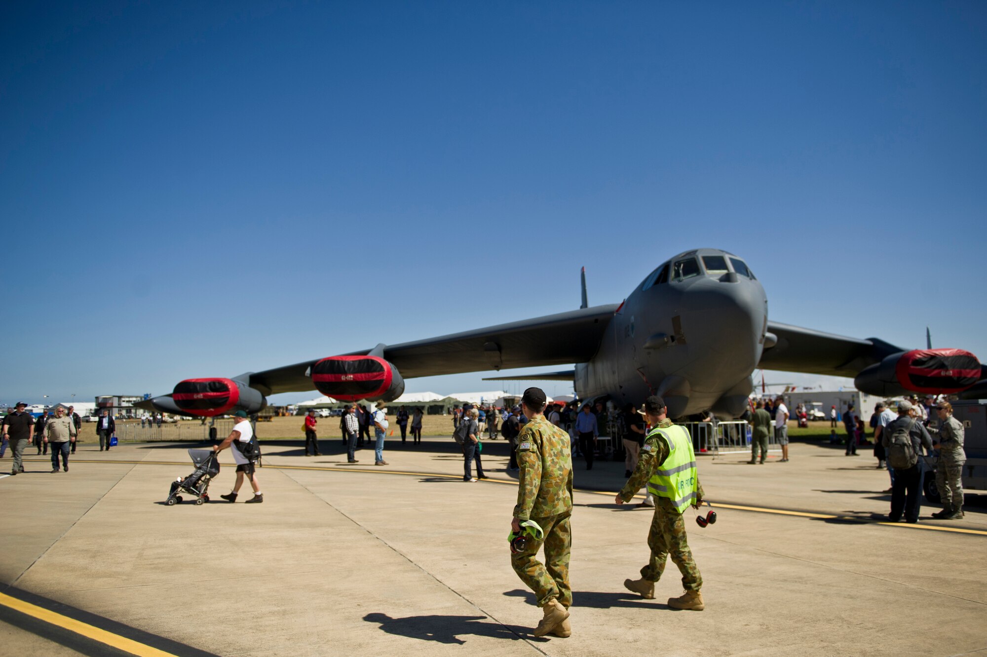 Royal Australian Air Force airmen take a moment to look at a U.S. Air Force B-52 Stratofortress from Anderson Air Force Base, Guam, the Australian International Airshow, March 1, 2013 at Avalon Airport in Geelong, Australia. Approximately 220 U.S. service members along with the U.S. Air Force's F-22 Raptor, C-17 Globemaster III, F-16 Fighting Falcon, B-52 Stratofortress, and KC-135 Stratotanker are supporting AIA 2013, which allows a unique opportunity for the United States to showcase its aviation prowess and strengthen military-to-military ties with our Pacific allies and partners. (Department of Defense photo by U.S. Air Force Tech. Sgt. Michael R. Holzworth/Released)