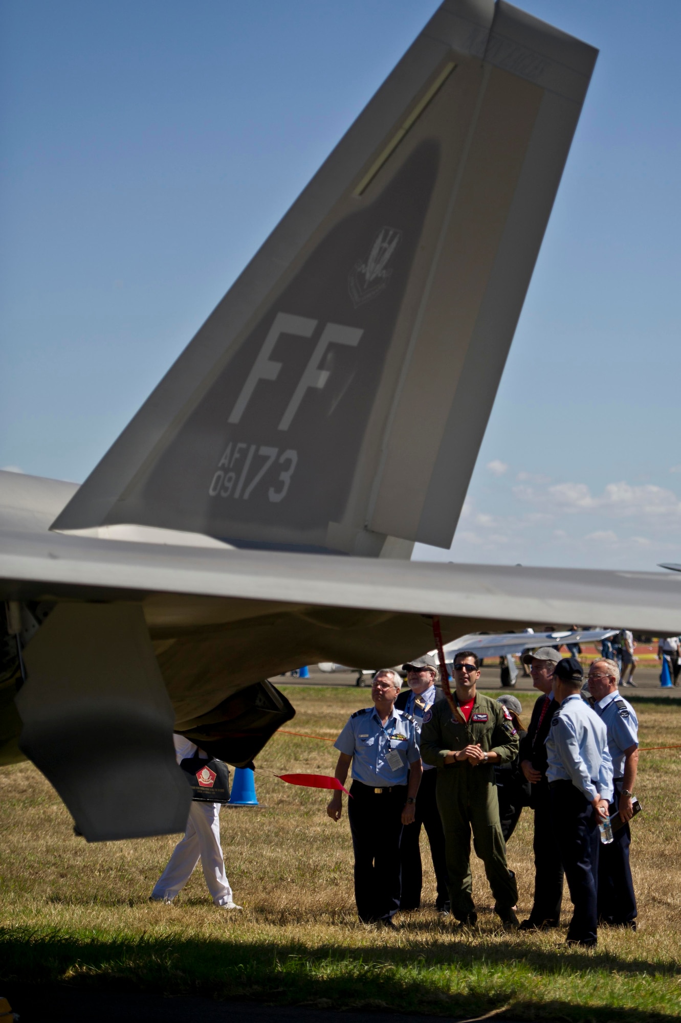 U.S. Air Force Capt. Peter Liggieri discuss the capabilities of the F-22 Raptor with members of the Royal Australian Air Force and representatives from the Parliament of Australia March 1, 2013, during Australian International Airshow 2013. Liggieri is a F-22 Raptor pilot, assigned to the 94th Fighter Squadron deployed to the 18th Fighter Wing, Kadena Air Base, Japan in support of pacific theater operations. Approximately 220 U.S. service members along with the U.S. Air Force's F-22 Raptor, C-17 Globemaster III, F-16 Fighting Falcon, B-52 Stratofortress, and KC-135 Stratotanker are supporting AIA 2013, which allows a unique opportunity for the United States to showcase its aviation prowess and strengthen military-to-military ties with our
Pacific allies and partners. (Department of Defense photo by U.S. Air Force Tech. Sgt. Michael R. Holzworth/Released)