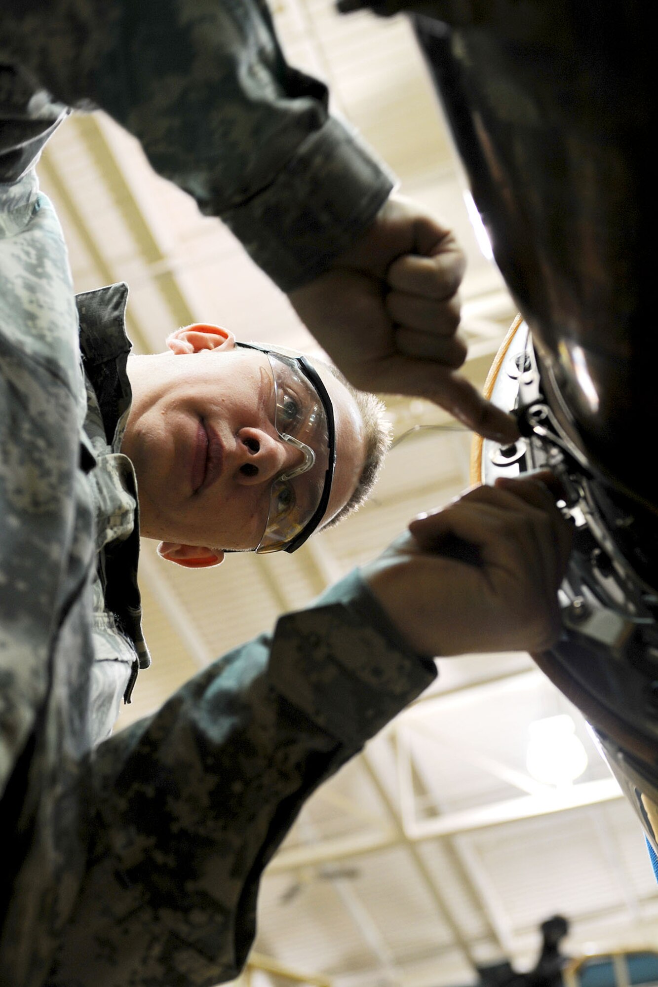 U.S. Army Pvt. Andrew Hewett, an Advanced Individual Training student assigned to the 2nd Battalion, 210th Aviation Regiment, places safety wire on a CH-47 Chinook engine during training at Fort Eustis, Va., Feb. 20, 2013. The battalion estimates it will train more than 4,000 Soldiers in various levels on helicopter maintenance. (U.S. Air Force photo by Staff Sgt. Ashley Hawkins/Released) 