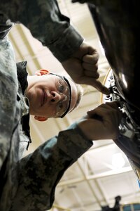 U.S. Army Pvt. Andrew Hewett, an Advanced Individual Training student assigned to the 2nd Battalion, 210th Aviation Regiment, places safety wire on a CH-47 Chinook engine during training at Fort Eustis, Va., Feb. 20, 2013. The battalion estimates it will train more than 4,000 Soldiers in various levels on helicopter maintenance. (U.S. Air Force photo by Staff Sgt. Ashley Hawkins/Released) 
