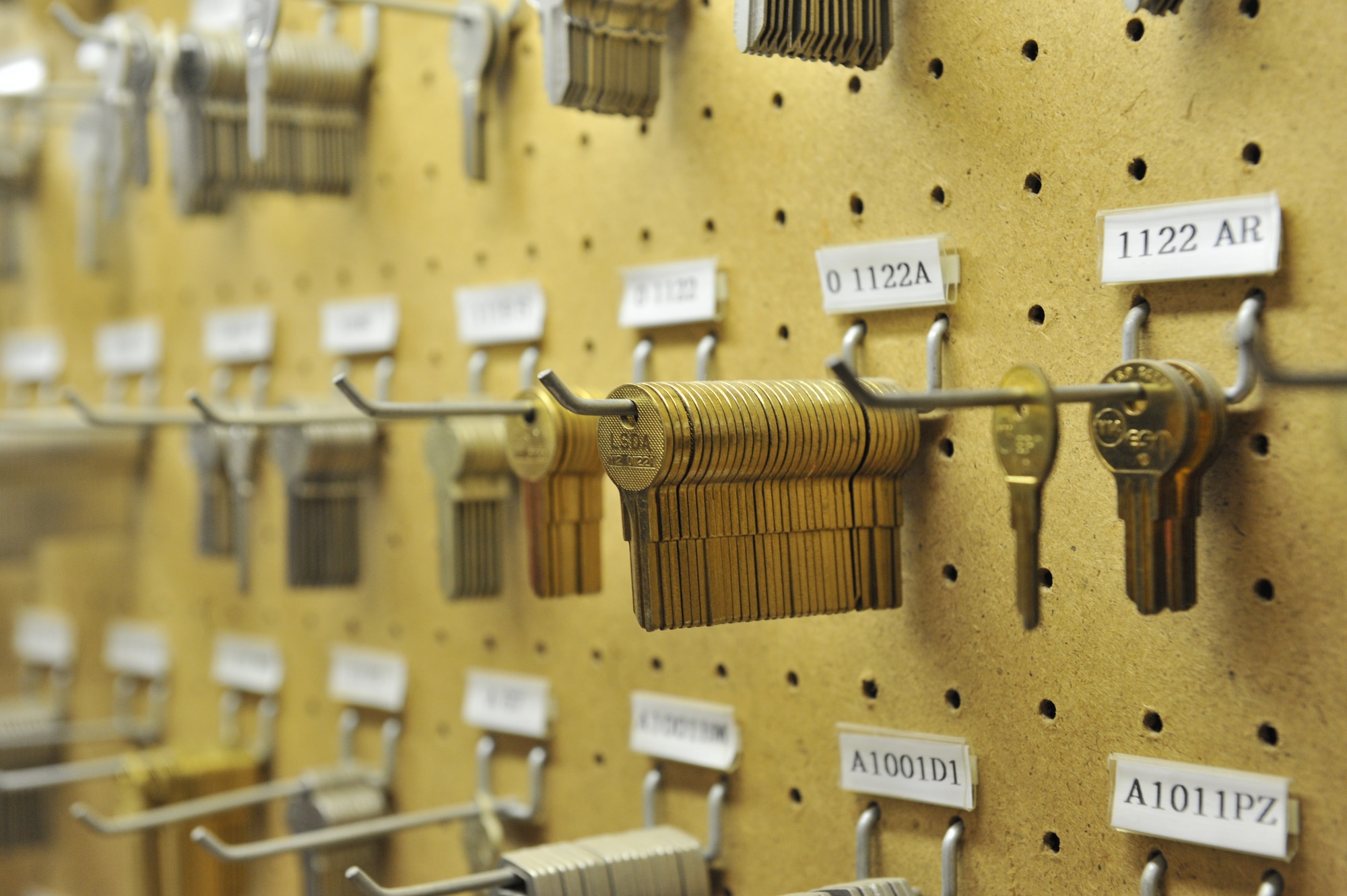New keys hang on a wall in the workshop of the locksmith waiting to be cut, Shaw Air Force Base, S.C., March 1, 2013. The 20th Civil Engineer Squadron is home to the only locksmith workshop on base. (U.S. Air Force photo by Senior Airman Amber E. N. Jacobs/Released)