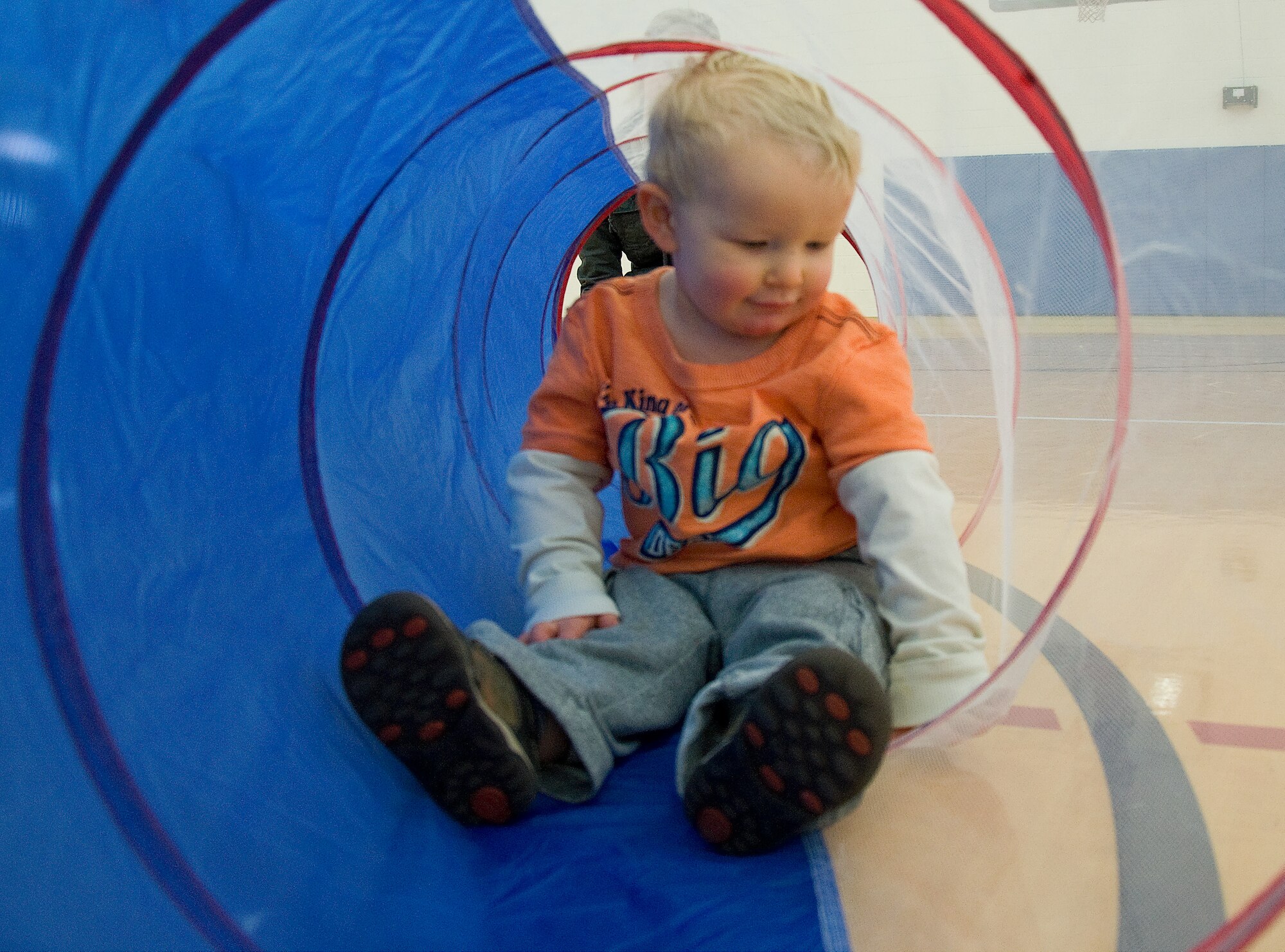Ryan Joice plays in the tunnel at the Mommies-N-Me and Daddies Too group Feb. 21, 2013, at the Youth Center on Dover Air Force Base, Del. The program is an outlet for parents to bring their children out to play and get to meet other children and parents. (U.S. Air Force photo/ Airman 1st Class Ashlin Federick)