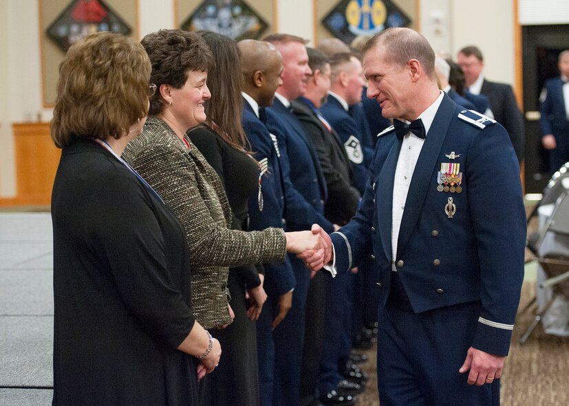 Col. Robert Stanley, 341st Missile Wing commander, congratulates Jeanne Wilson, 341st Medical Support Squadron pharmacy technician at the Grizzly Bend on Feb. 22. Wilson was named the Civilian of the Year Category 1 for 2013 during the Annual Awards ceremony. (U.S. Air Force photo/Beau Wade) 
