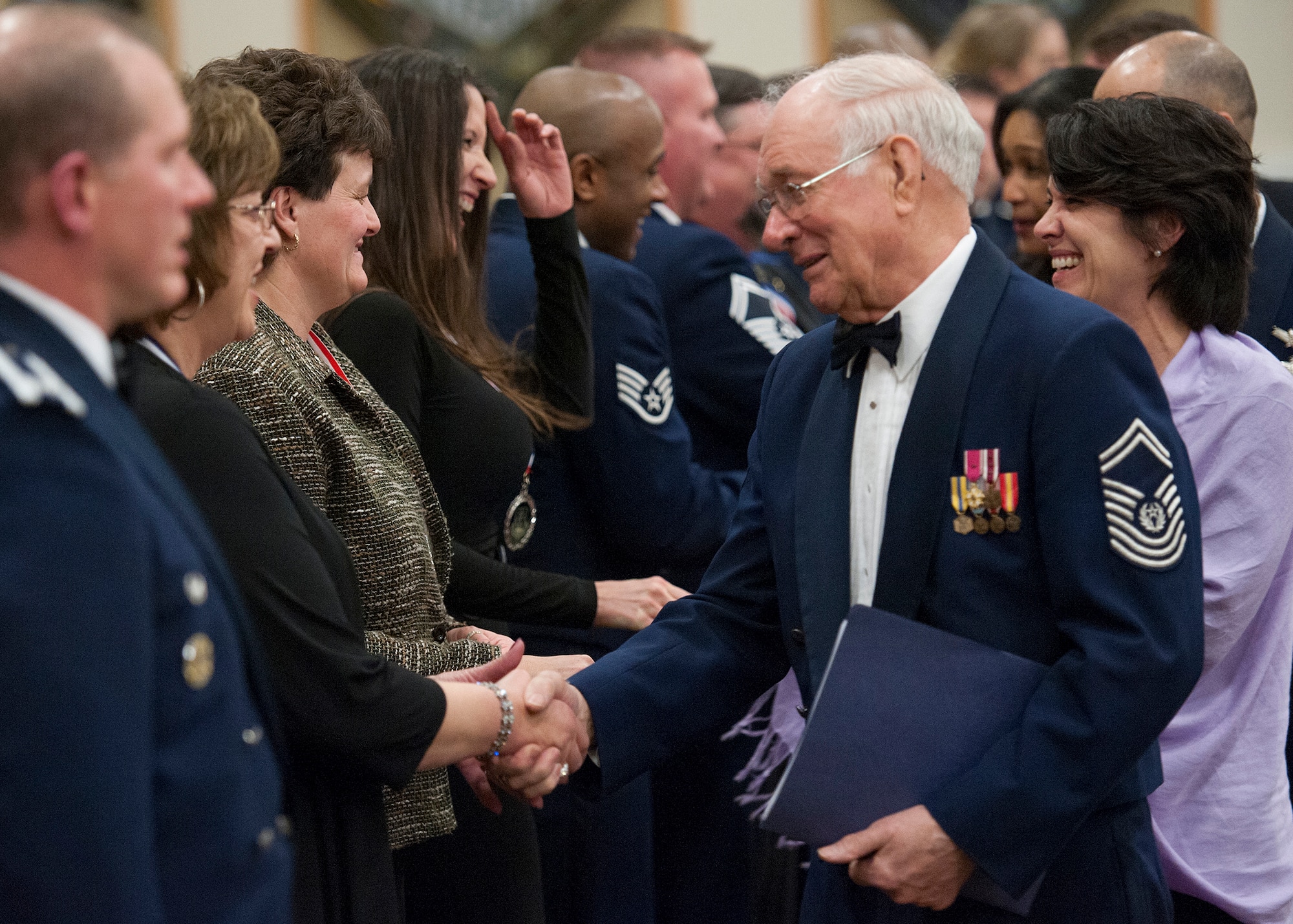 Eighth Chief Master Sgt. of the Air Force, Sam Parish, congratulates Civilian Supervisor of the Year Category 2 Award Winner Annette Terry, 341st Force Support squadron, Human Resource Officer. Out of more than 40 nominees, only 10 members of Team Malmstrom received an award during the awards banquet at the Grizzly Bend on Feb. 22. (U.S. Air Force photo/Beau Wade)
