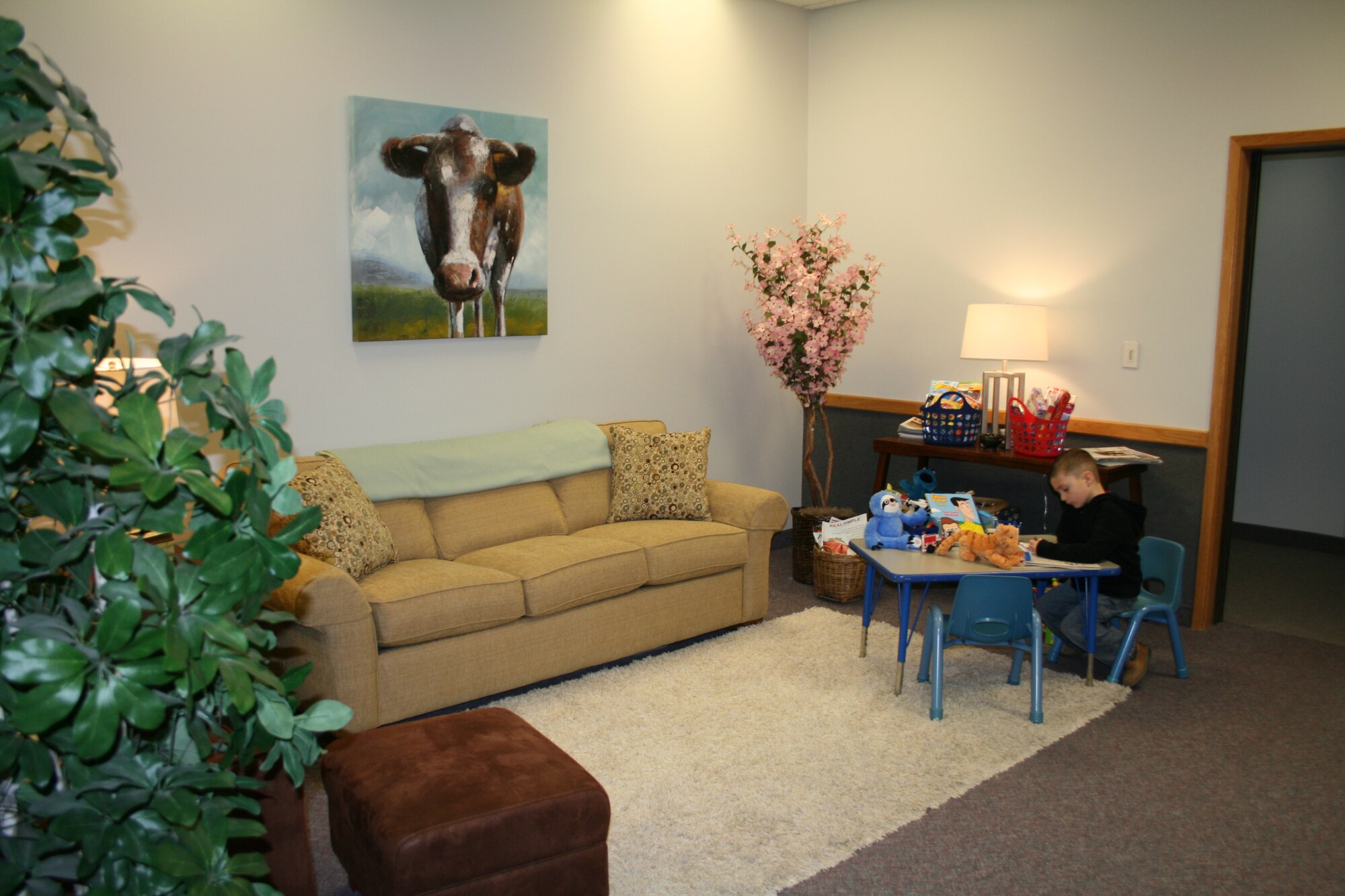 A child plays with toys in the modified victim and witness room.  The room was made to help victims and witnesses of sexual assault and harassment, as well as their children, feel comfortable during the interview process.  (U.S. Air Force Courtesy Photo)