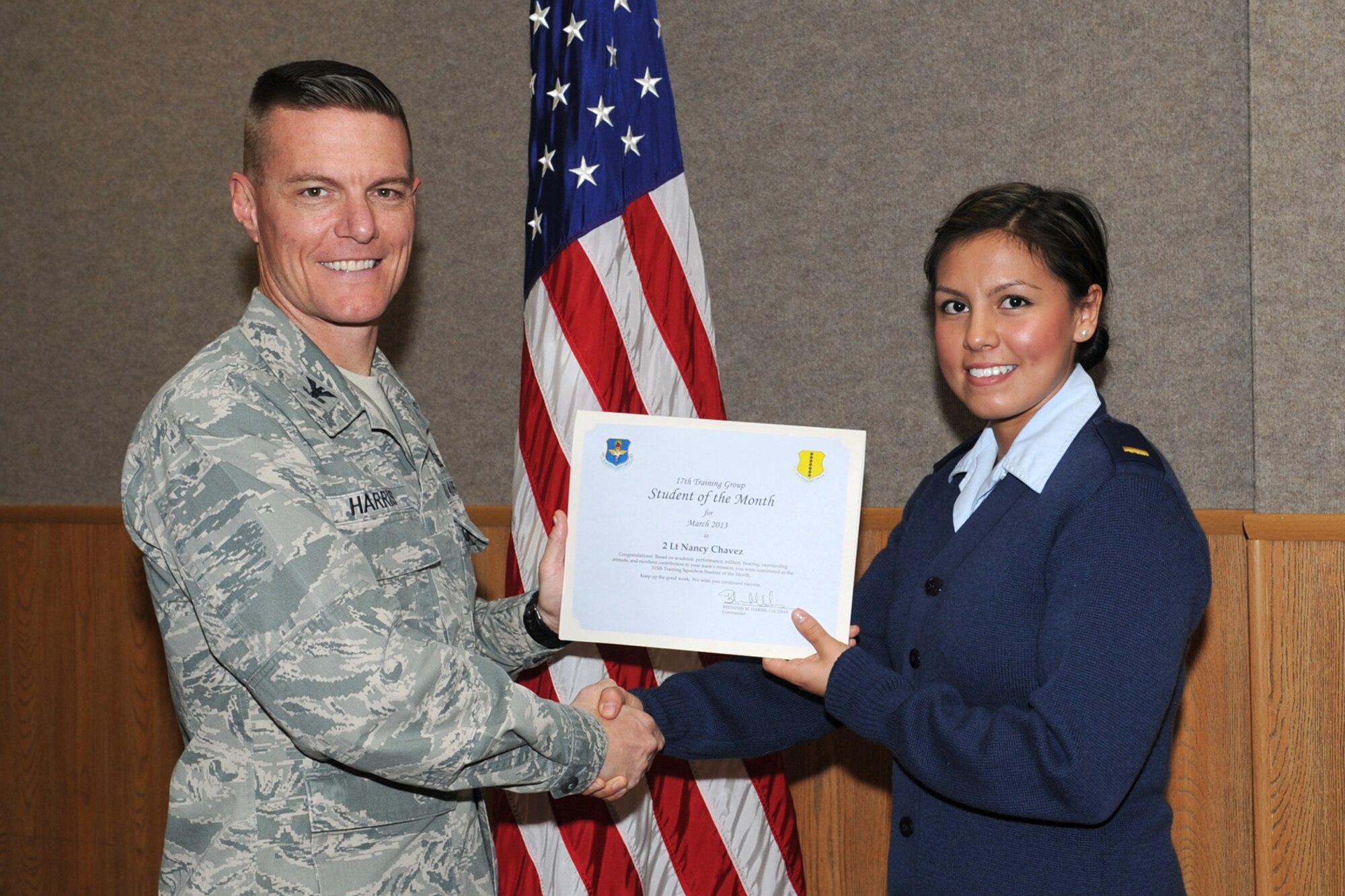 GOODFELLOW AIR FORCE BASE, Texas-- Col. Brendan Harris, 17th Training Group Commander, presents 2nd Lt. Nancy Chavez with the 315th Training Squadron Officer Student of the Month award for February March 1. (U.S. Air Force photo/Staff Sgt. Laura R. McFarlane)