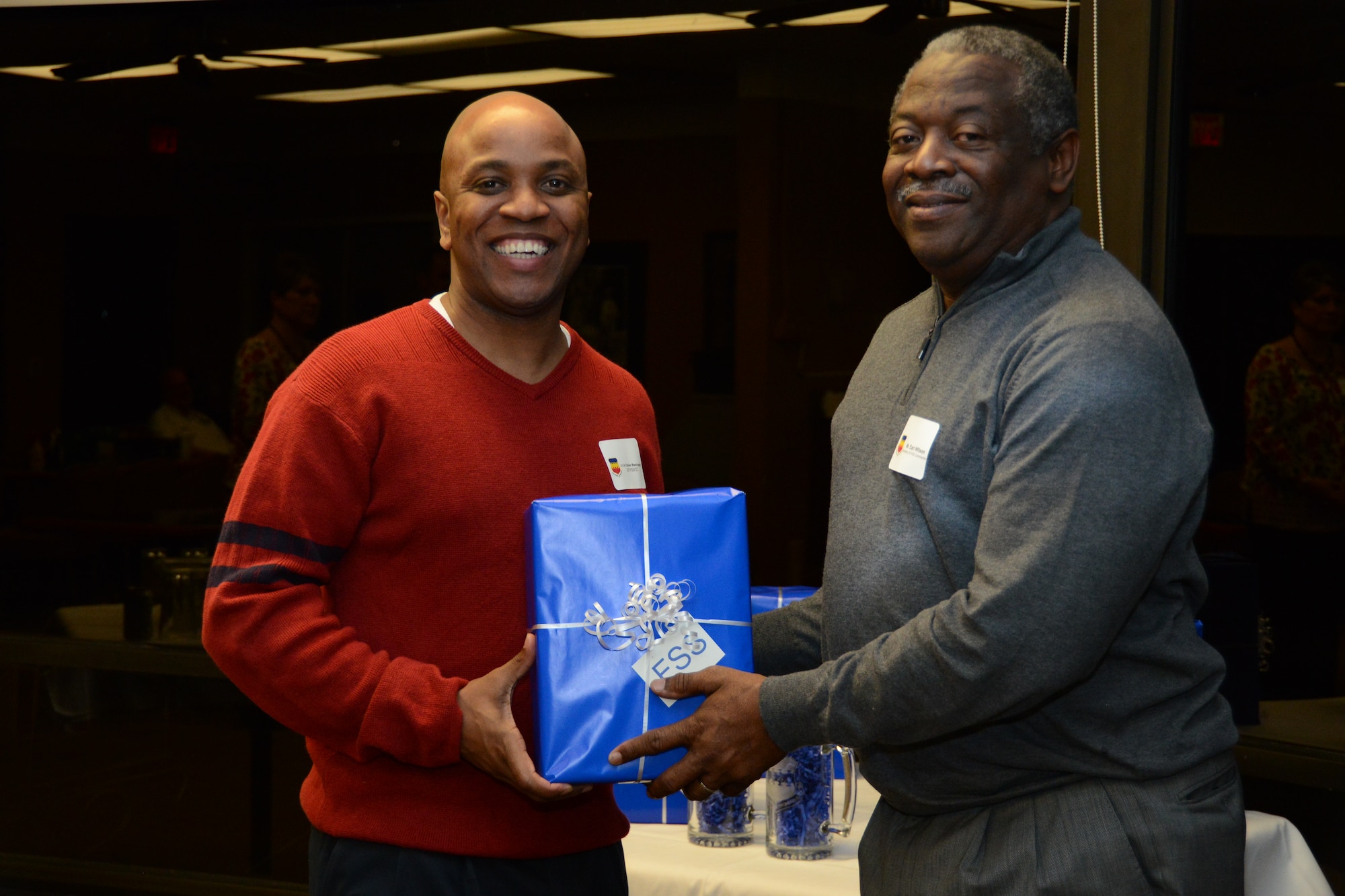 U.S. Air Force Lt. Col Dalian Washington, 20th Force Support Squadron, presents Earl Wilson, Orr Company  with a small gift at the 20th Mission Support Group honorary commander dinner  at the Carolina Skies Golf Course here Feb. 28, 2013.  The purpose of the Air Force honorary commander program is to build relationships with members of the local community and encourage them to share the AF story.  (U.S. Air Force photo by Capt. Ann Blodzinski/Released)