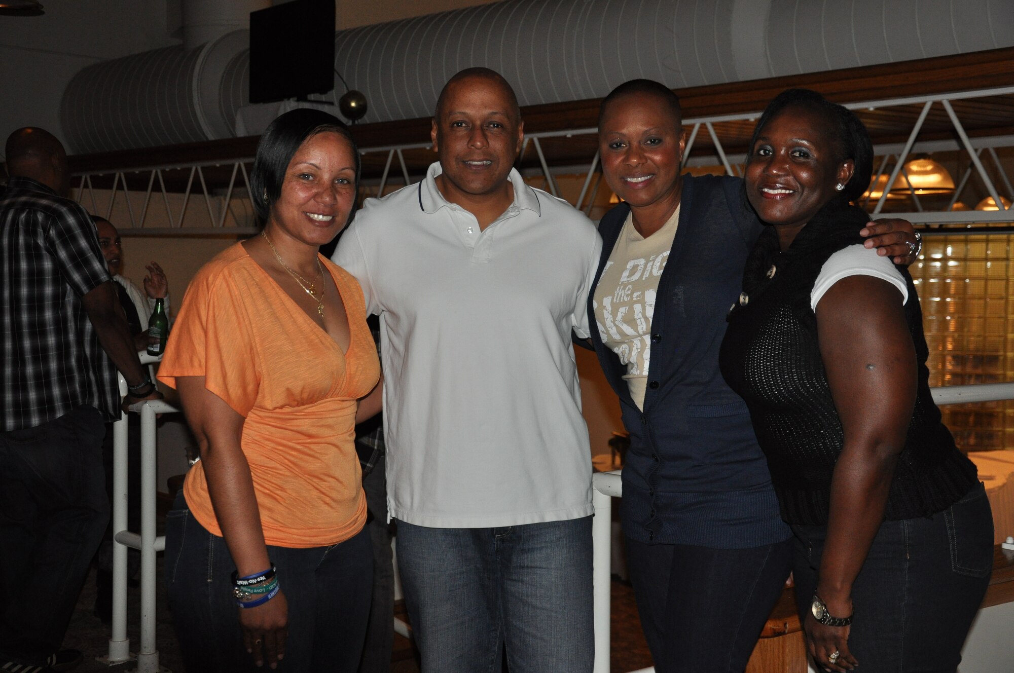 Open Mic Night was held at the Tides Feb. 15. Attendees sang, recited poems, danced and even performed a few magic tricks. (Left to right) Yvette Coleman, AFTAC, Brig. Gen. Anthony Cotton, 45th Space Wing commander, Jada Stevens, 45th Medical Support Squadron and Master Sgt. Jillian John, 45th Medical Group. (U.S. Air Force Photo/Nelly Slaughter)
