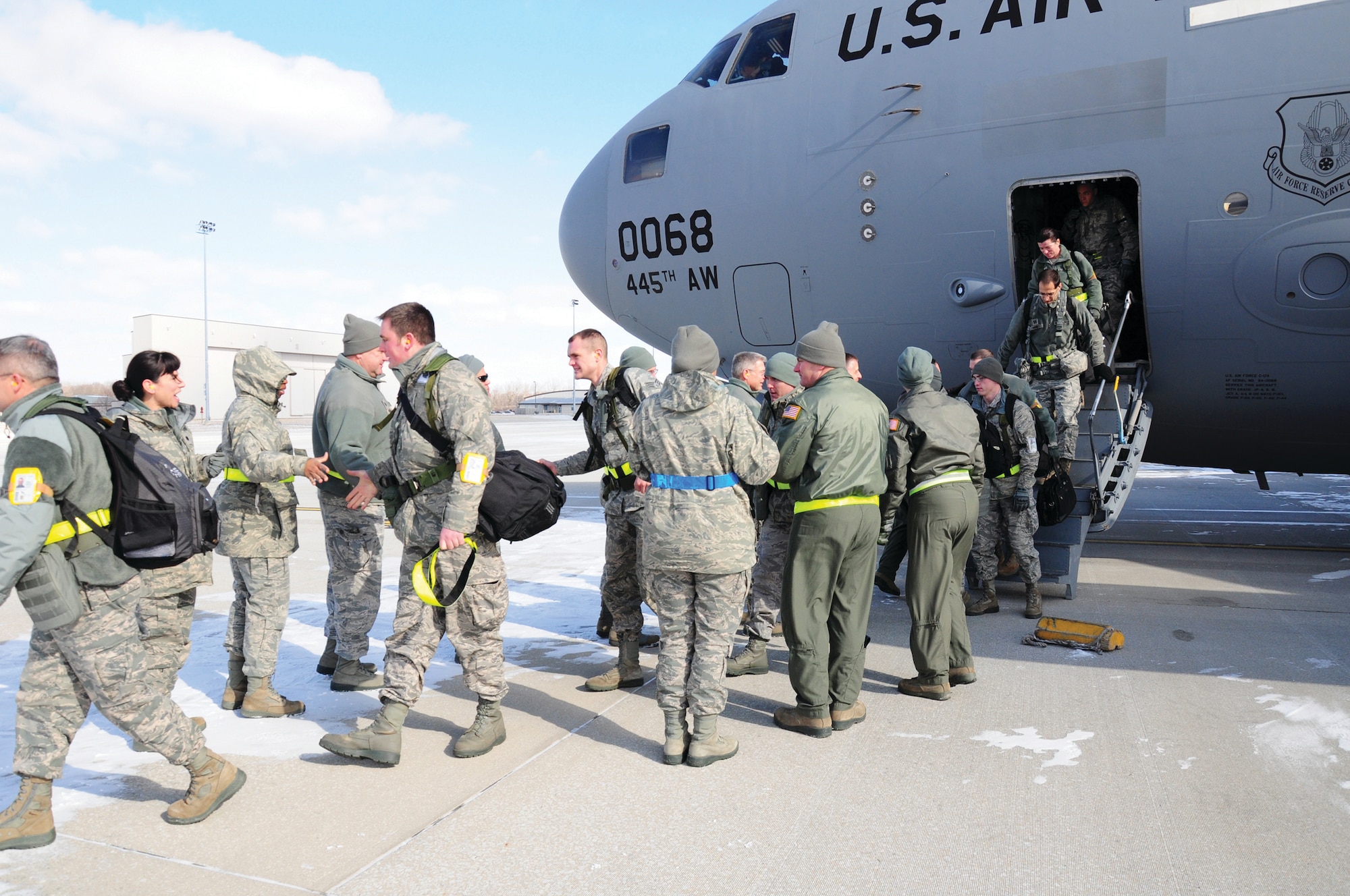 WRIGHT-PATTERSON AIR FORCE BASE, Ohio - 445th Airlift Wing reservists arrive at Wright-Patterson AFB Feb. 1 after spending four days in Gulfport, Miss., with the 452nd Air Mobility Wing, March Air Reserve Base, Calif., participating in a joint operational readiness inspection. (U.S. Air Force photo/Stacy Vaughn)