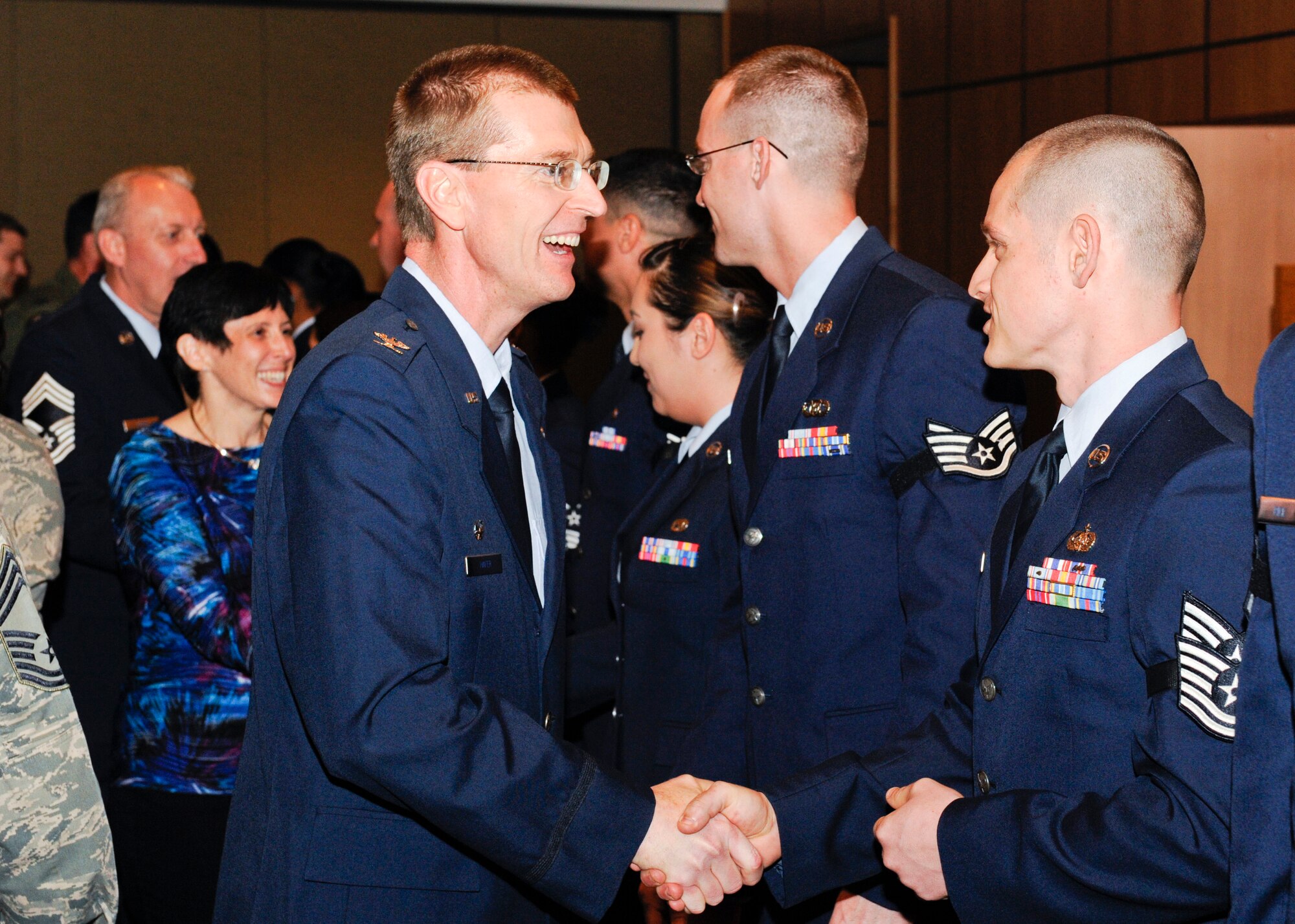 March promotees receive handshakes from fellow Airmen of Team Tyndall Feb. 28 at the Horizons Community Activity Center. (U.S. Air Force photo by Chris Cokeing)