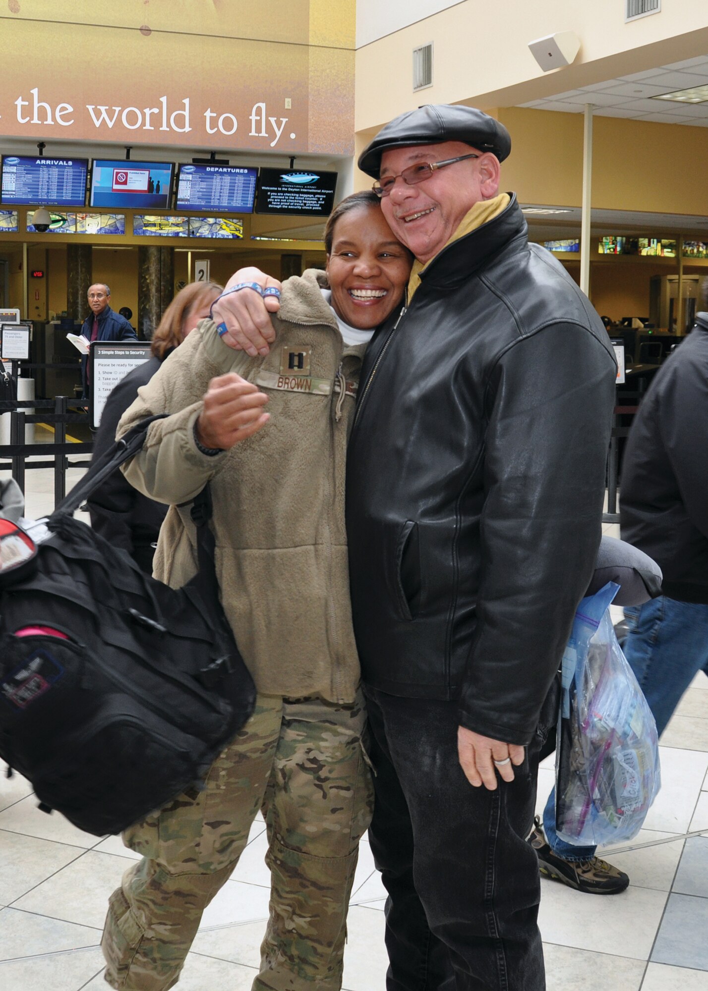 WRIGHT-PATTERSON AIR FORCE BASE, Ohio - Family, friends and members of the 445th Airlift Wing welcome home Capt. Jenice Brown, 445th Aeromedical Evacuation Squadron flight nurse, and other members of her squadron returning from a deployment to Southwest Asia at the Dayton International Airport Feb. 10. (U.S. Air Force photo/Senior Airman Matthew Cook)