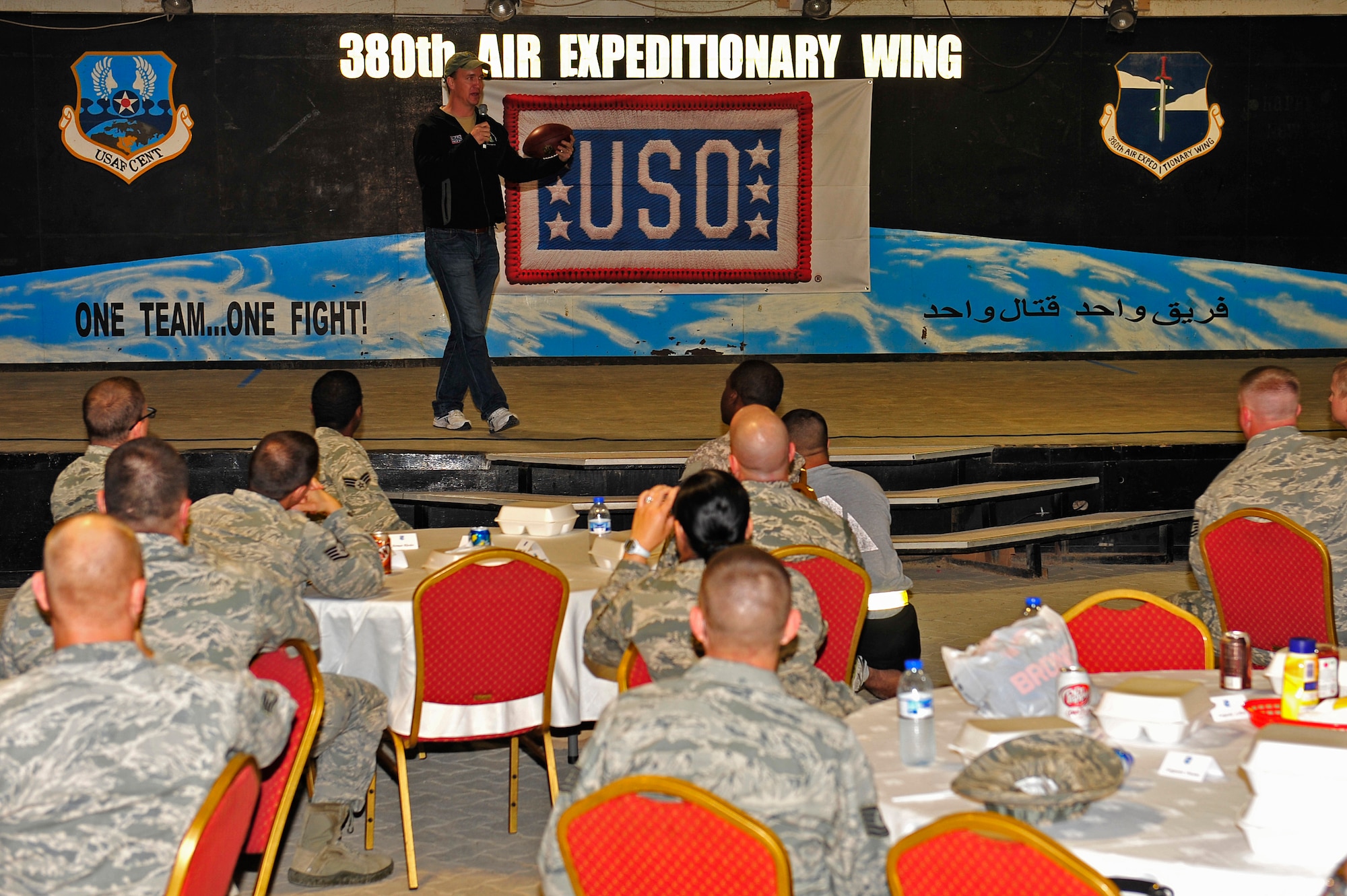 Denver Broncos Quarterback Peyton Manning addresses the members of the 380th Air Expeditionary Wing at an undisclosed location in Southwest Asia Feb. 28, 2013. Manning visited the men and women of the 380 AEW to express the country’s gratitude for their service and sacrifice during the Vice Chairman of the Joint Chiefs of Staff Adm. James A. Winnefeld USO tour. (U.S. Air Force photo by Tech. Sgt. Christina M. Styer/Released)