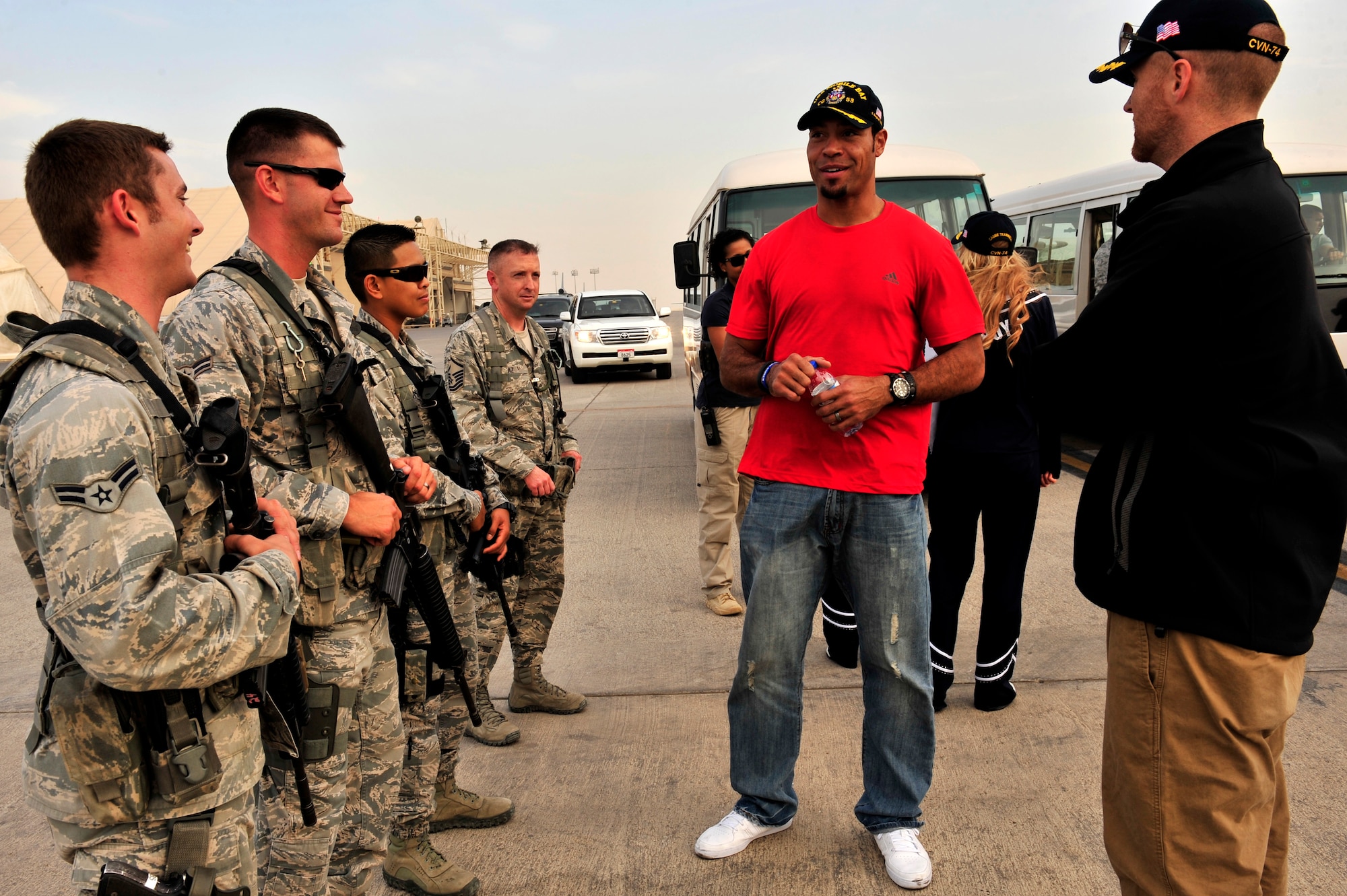 Tampa Bay Buccaneers Pro Bowl Receiver Vincent Jackson talks to 380th Air Expeditionary Security Forces members at an undisclosed location in Southwest Asia Feb. 28, 2013. Jackson visited the men and women of the 380th Air Expeditionary Wing to express the country’s gratitude for their service and sacrifice during the Vice Chairman of the Joint Chiefs of Staff Adm. James A. Winnefeld USO tour. (U.S. Air Force photo by Tech. Sgt. Christina M. Styer/Released)