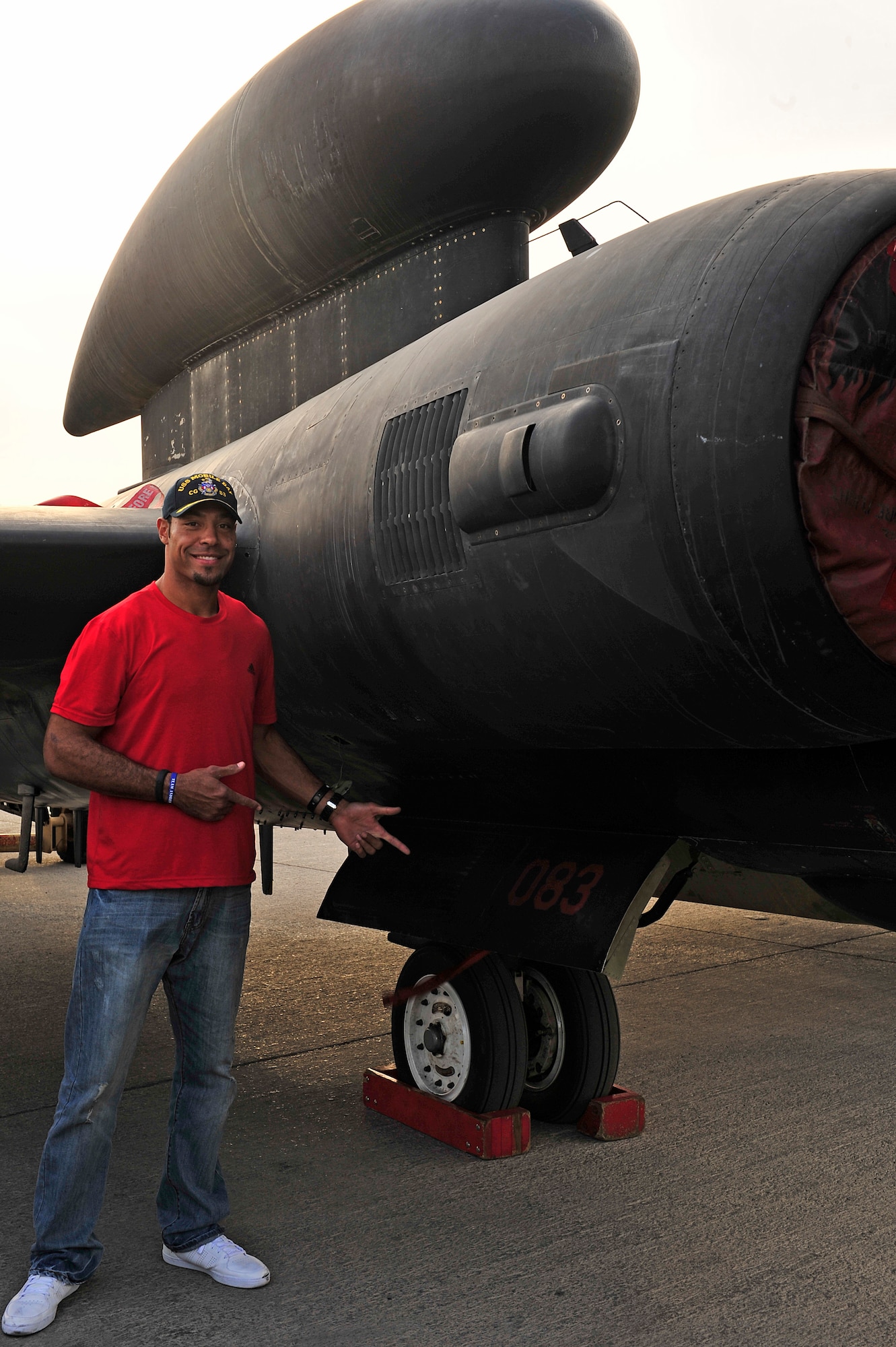Tampa Bay Buccaneers Pro Bowl Receiver Vincent Jackson poses with a U-2 adorned with his number, 83, at an undisclosed location in Southwest Asia Feb. 28, 2013. Jackson visited the men and women of the 380th Air Expeditionary Wing to express the country’s gratitude for their service and sacrifice during the Vice Chairman of the Joint Chiefs of Staff Adm. James A. Winnefeld USO tour. (U.S. Air Force photo by Tech. Sgt. Christina M. Styer/Released)