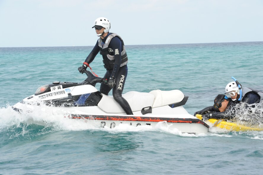 Tom Masumoto, Torii Station administration specialist, is rescued by Okinawa Prefectural Police during a joint-field bilateral exercise on Torii Station, Japan, Feb. 26, 2013. Masumoto played a victim who ejected into the sea during a U.S. military aircraft crash scenario that tested U.S. and Japan forces on their ability to rescue service members and civilians, by aircraft or jet skis, from open water. (U.S. Air Force photo/Airman 1st Class Malia Jenkins) 

