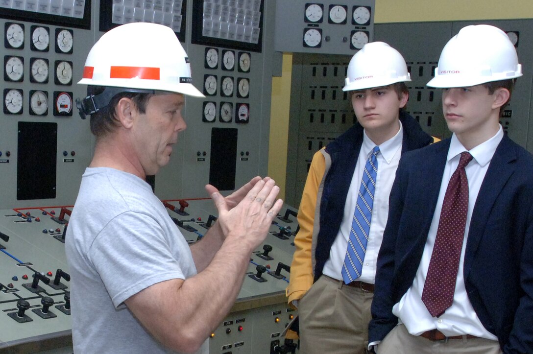 Larry Myers (Left), U.S. Army Corps of Engineers Nashville District maintenance engineer at the Cheatham Power Plant, gives Montgomery Bell Academy Sophomores Jack Sonday (Middle) and Greg Quesinberry a tour of the control room at the facility in Ashland City, Tenn., March 1, 2013. (USACE photo by Lee Roberts)