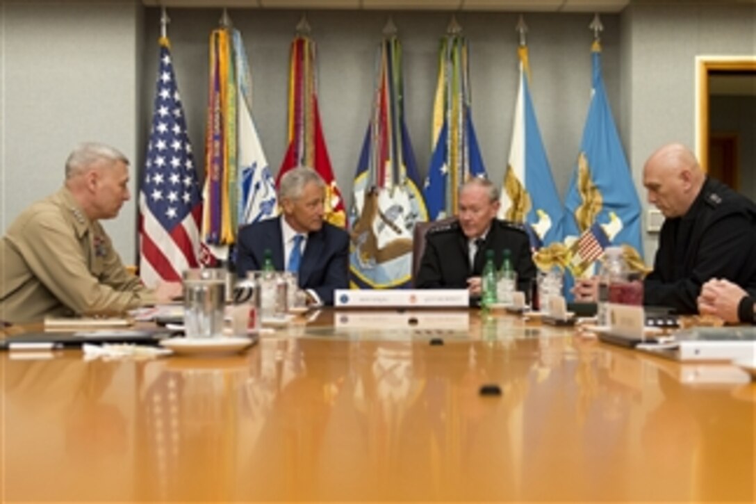 Secretary of Defense Chuck Hagel, second from left, attends a meeting in the "Tank" with Chairman of the Joint Chiefs of Staff Gen. Martin E. Dempsey, second from right, and members of the Joint Chiefs of Staff in the Pentagon in Arlington, Va., on March 1, 2013.  Assistant Commandant of the Marine Corps Gen. John M. Paxton, Jr., left, and Chief of Staff of the Army Raymond T. Odierno, right, joined in the discussion.  
