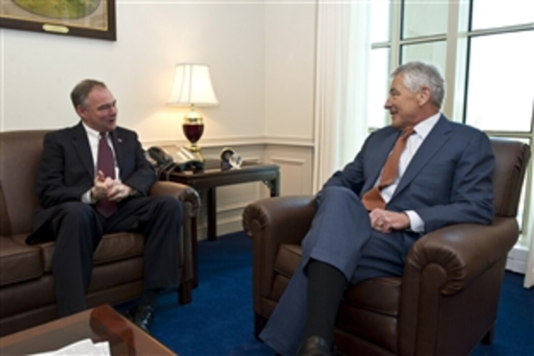 Defense Secretary Chuck Hagel, right, meets with U.S. Sen. Tim Kaine of Virginia at the Pentagon, March 4, 2013, where the two leaders discussed the effects of sequestration. 