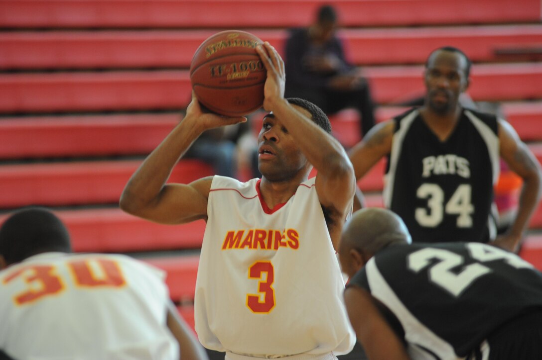 Ajwon Gadison, a guard for the Quantico Bulldogs men’s varsity basketball team, shoots a free throw during a varsity basketball game against the Fort Meade Patriots at Barber Physical Activity Center on Sunday. The Bulldogs lost 87-79.
