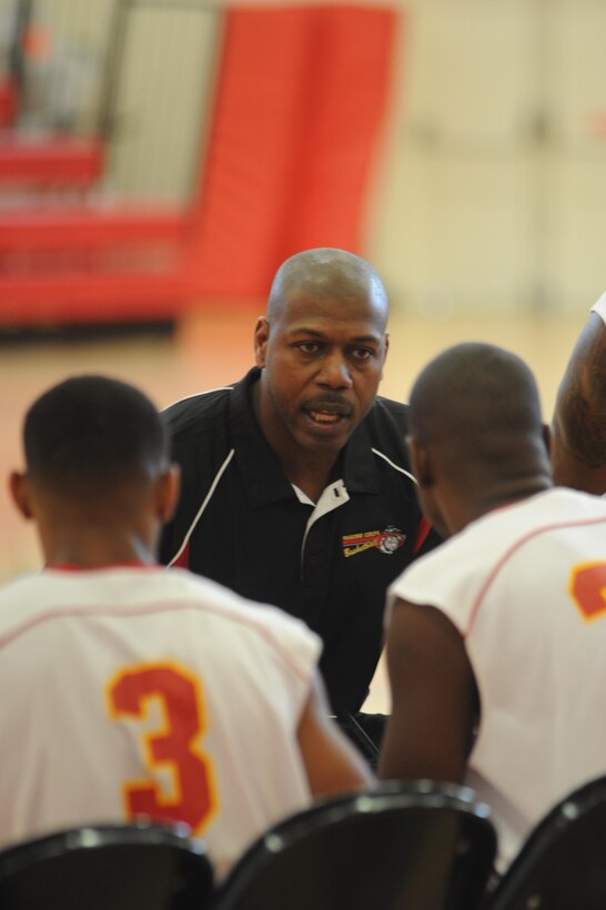 Jelani Nix, coach for the Quantico men’s varsity basketball team, gives instructions to his players during a varsity basketball game against the Fort Meade Patriots at Barber Physical Activity Center on March 3.