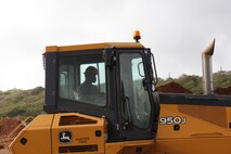 Lance Cpl. Kamara Alimamy, a heavy equipment operator with Combat Logistics Detachment 39, helps build a landfill area Feb. 26 on Andersen Air Base. Alimamy is part of Exercise Guahan Shield, an exercise that will facilitate multiservice engagement, set conditions for bilateral and multilateral training opportunities, and support rapid response to potential theater crises and contingency operations in the Asia-Pacific region. CLD-39 is part of Engineer Support Battalion, 3rd Marine Logistics Group, III Marine Expeditionary Force. 