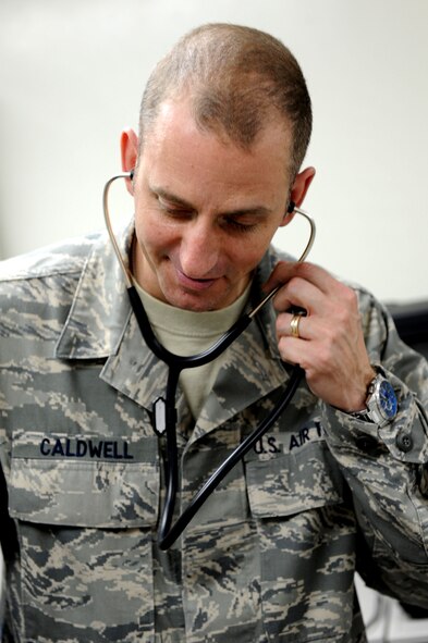 U.S. Air Force Tech. Sgt. Douglas Caldwell, Okuma independent medical technician, demonstrates using a stethoscope on Okuma, Japan, Feb. 2, 2013. Caldwell is one of two IDMTs and must overcome the complications that arise when being stationed at a remote location. (U.S. Air Force photo/Airman 1st Class Brooke P. Doyle)