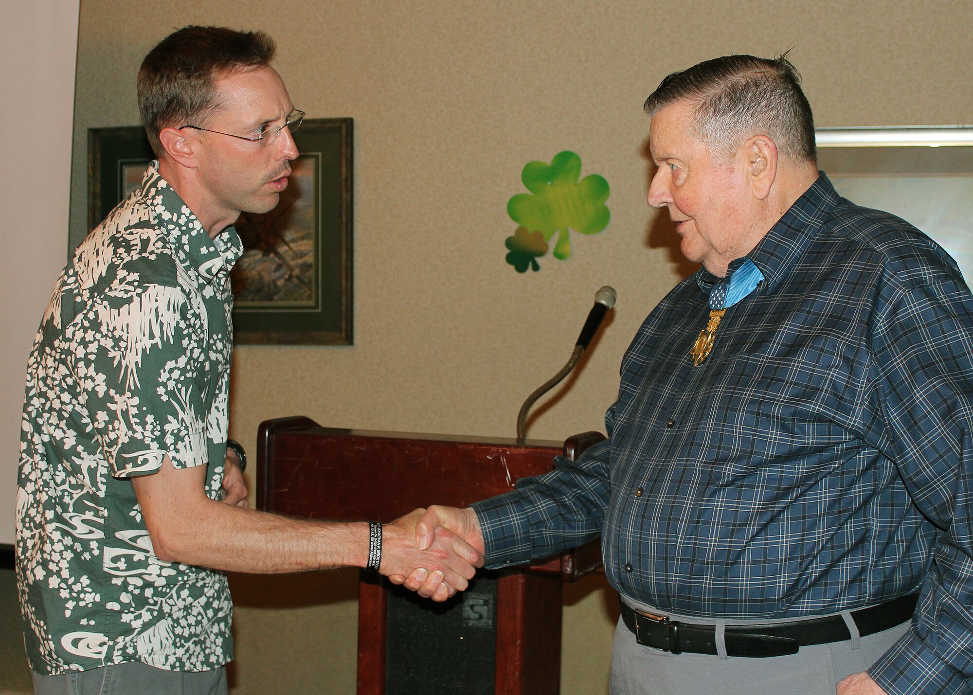 Capt. Rush Taylor, Airlift Tanker Association (A/TA) Diamond Head Chapter President, presents U.S. Air Force Medal of Honor recipient Col. (retired) Joe Jackson an A/TA Chapter coin.  Col. Jackson shared his experiences as a career military aviator at the A/TA dinner at the Officer's Club, at Joint Base Pearl Harbor-Hickam, Hawaii, Mar. 2, 2013.  During his 33 years of distinguished service from World War II to Korea to Vietnam, Col. Jackson flew 32 different airframes.  After a dinner in his honor, he spoke about his participation in planning and directing U-2 aerial reconnaissance missions during the Cuban Missile Crisis. (U.S. Navy photo/Ensign Kalasi Andrews)