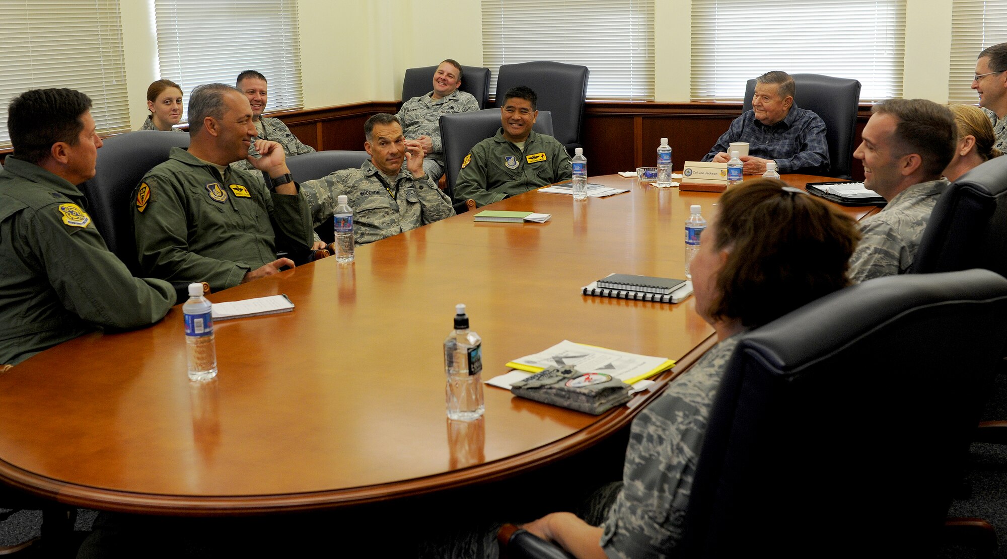 U.S. Air Force Medal of Honor recipient Col. (retired) Joe Jackson (head of table) attends the 15th Wing’s stand-up meeting and mission brief, at the 15th Wing headquarters building, Joint Base Pearl Harbor-Hickam, Hawaii, Mar. 1, 2013. Col. Jackson, a former enlisted, crew chief visited to check in on the progress of today’s Air Force maintainers and the aircraft squadrons. (U.S. Air Force photo/Tech. Sgt. Jerome S. Tayborn)