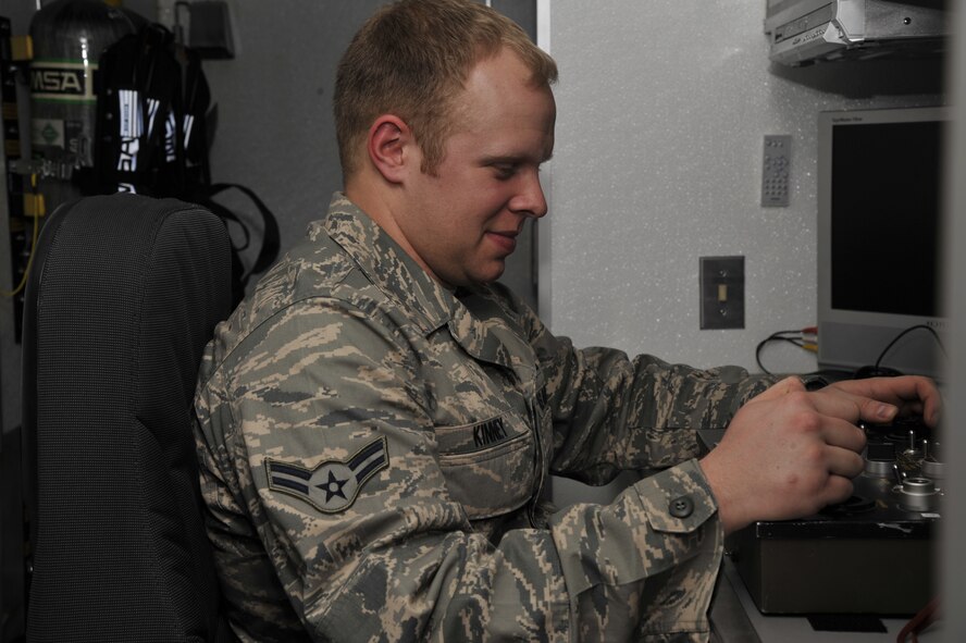 WHITEMAN AIR FORCE BASE, Mo. – Airman 1st Class Jeff Kinney, 509th Civil Engineer Squadron Explosive Ordinance Disposal team member, conducts training on driving a robot wirelessly from inside the base support response vehicle, Feb. 27. This training is done to enhance reconnaissance skills and help EOD technicians defeat improvised explosive devices. (U.S. Air Force photo/Airman 1st Class Keenan Berry) (Released)
