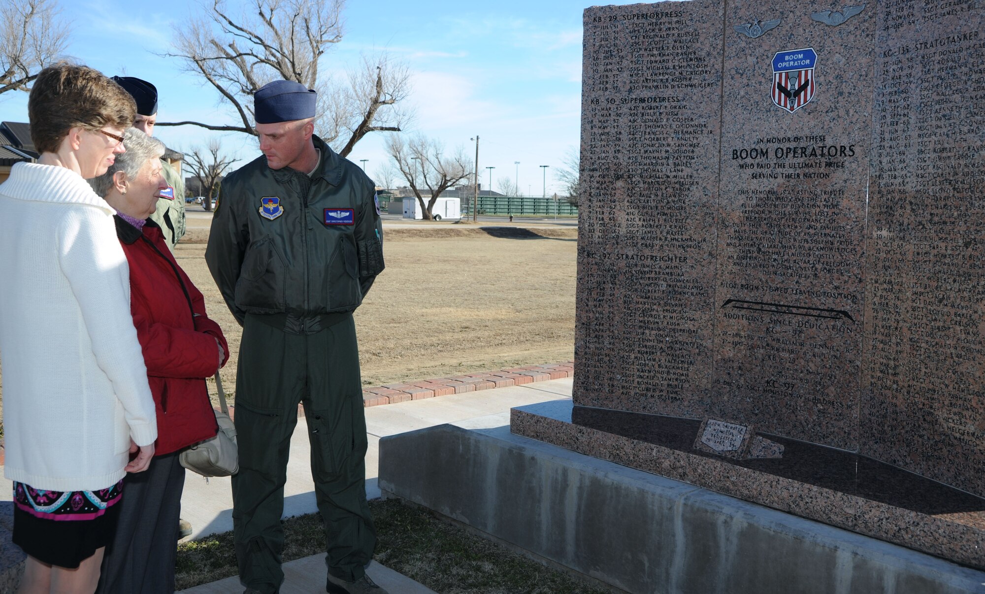 ALTUS AIR FORCE BASE, Okla. – Staff Sgt. Christopher Pedersen, 54th Air Refueling Squadron boom operator instructor, speaks to Luella Klaverkamp and Lisa Pollreis about the Boom Memorial at Wings of Freedom Park, March 3, 2013. Klaverkamp and Pollreis are the mother and sister of late KC-135 Stratotanker boom operator, Airman 1st Class Bruce Klaverkamp, who died in a plane crash, March 13, 1972, during a routine training mission at Carswell AFB, Texas. The family made an 18-hour drive from Clear Water, Minnesota to Altus AFB to visit the Boom Memorial where Bruce’s name is etched in stone, a testament to his service. (U.S. Air Force photo by Airman 1st Class Klynne Pearl Serrano / Released)
