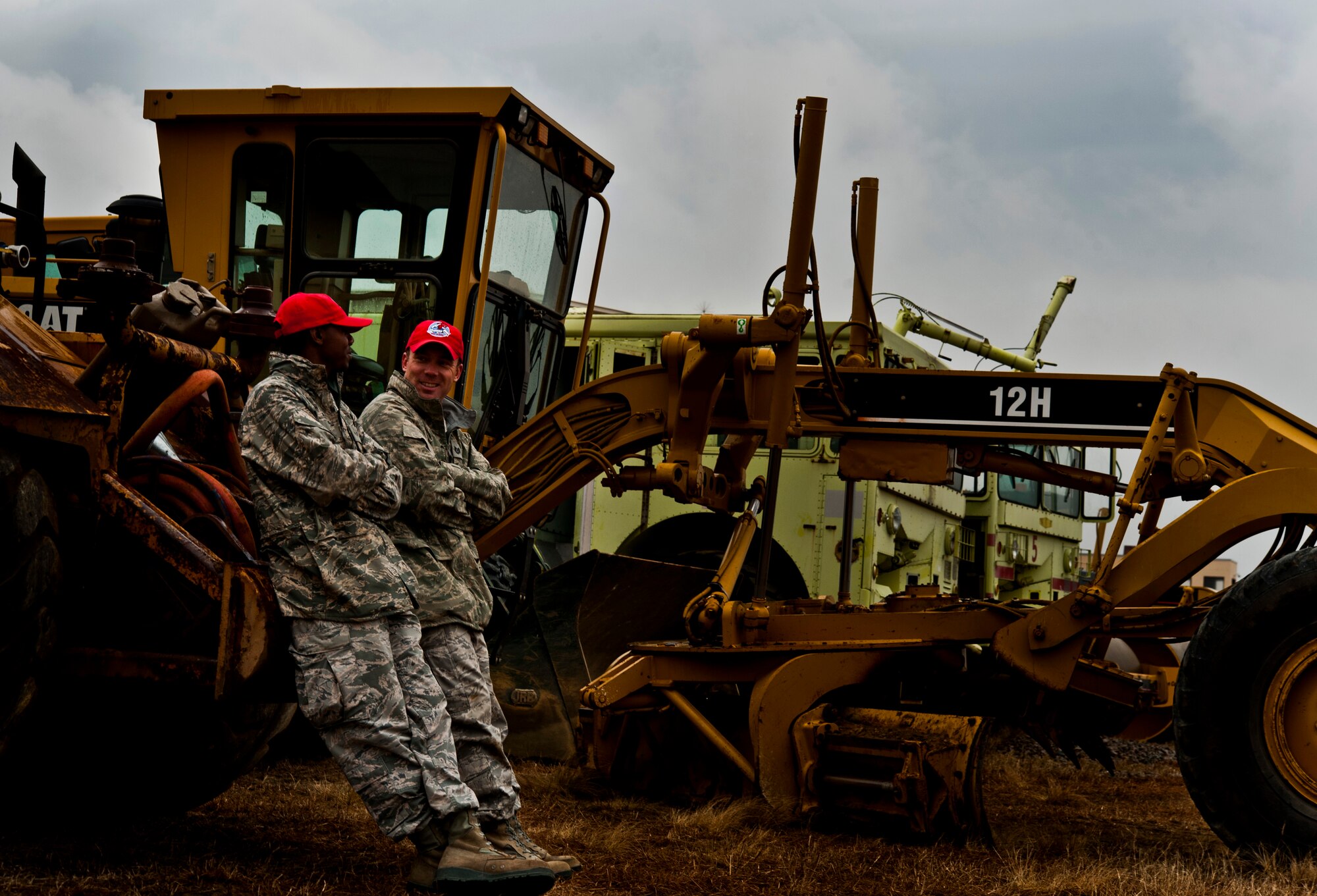 U.S. Air Force Tech. Sgt. Michael Shannon, 820th Rapid Engineer Deployable Heavy Operational Repair Squadron Engineers heavy equipment operator, and Senior Airman James Morris wait to see if the exercise will be canceled for the day due to weather Feb. 22, 2013, at Fort Bragg, N.C. The 820th RED HORSE job here is to repair dirt runways after C-130 Hercules and C-17 Globemaster aircraft perform combat landings and damage the surface. (U.S. Air Force photo by Senior Airman Daniel Hughes)