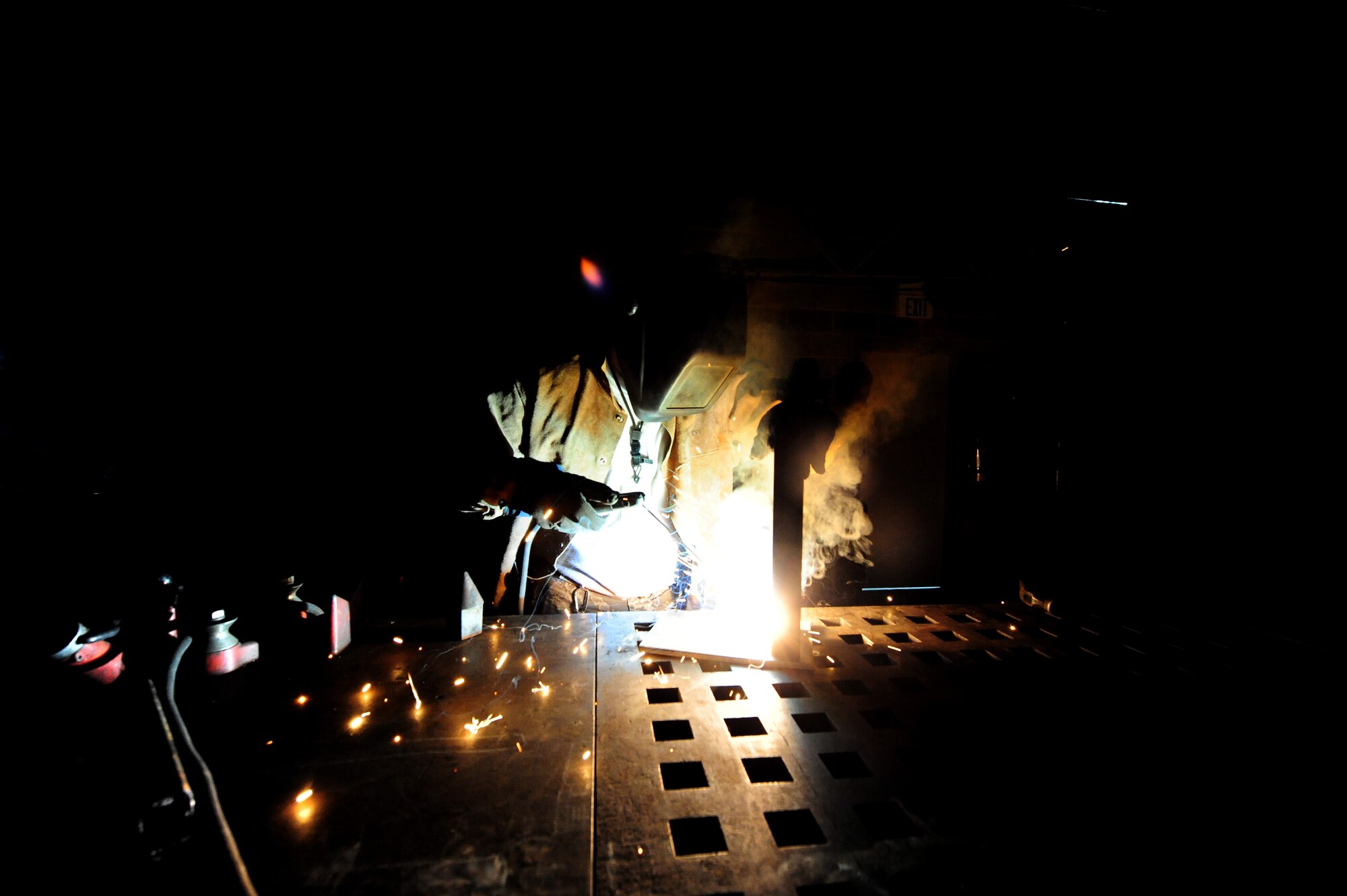 WHITEMAN AIR FORCE BASE, Mo. -- Staff Sgt. Adam Boyd, 509th Civil Engineer Squadron structural supervisor, welds a box blade for a snow plow, Feb. 27.  Structures Airmen perform jobs such as this one to save the Air Force from having to possibly spend money on parts made by civilian companies. (U.S. Air Force photo/Staff Sgt. Nick Wilson) (Released)
