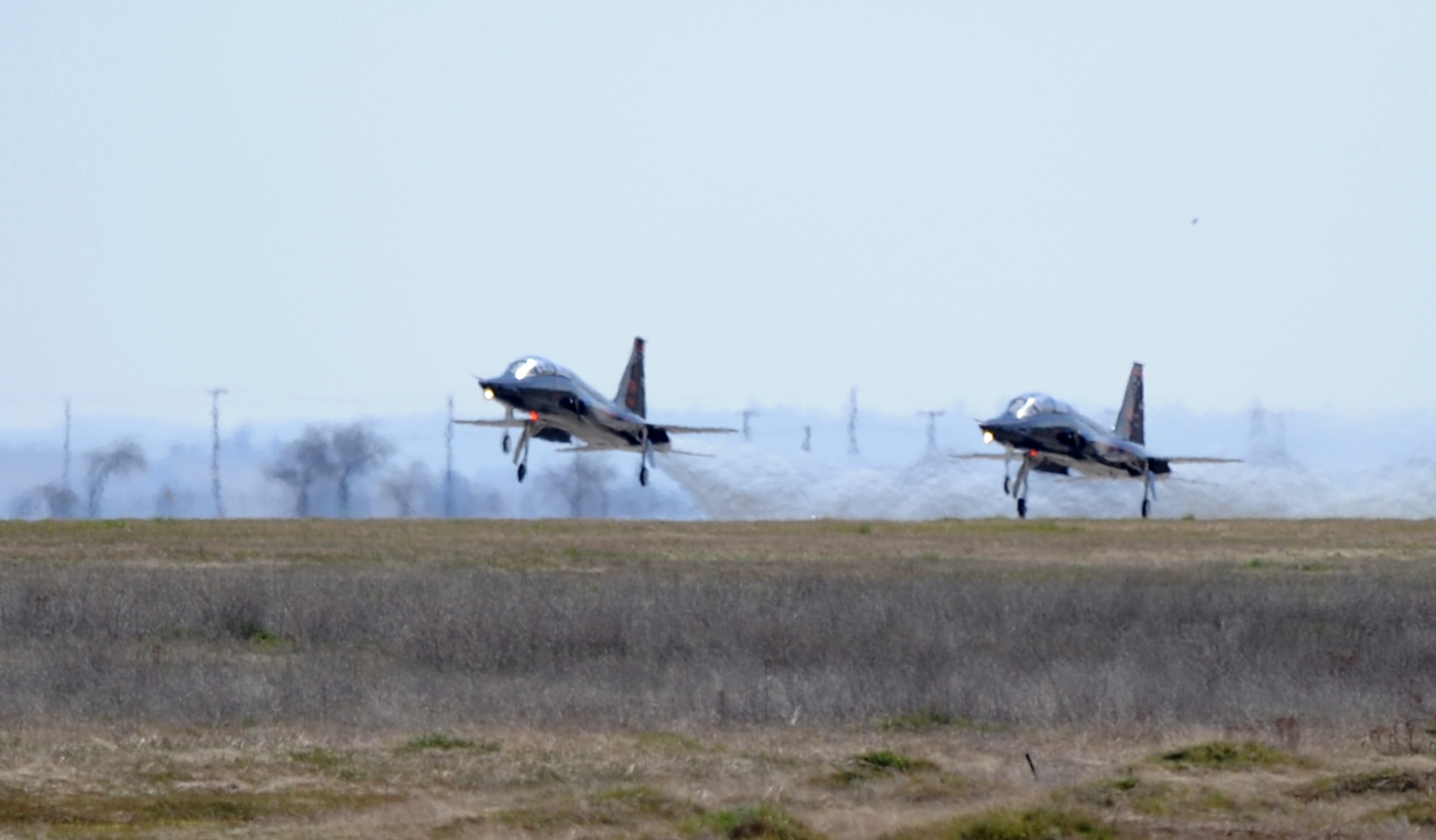 Two T-38 Talon jet trainer aircraft prepare to take off at Beale Air Force Base, Calif., Feb. 28, 2013. The Talon only needs 2,300 feet of runway to take off. (U.S. Air Force photo by Staff Sgt. Robert M. Trujillo/Released)