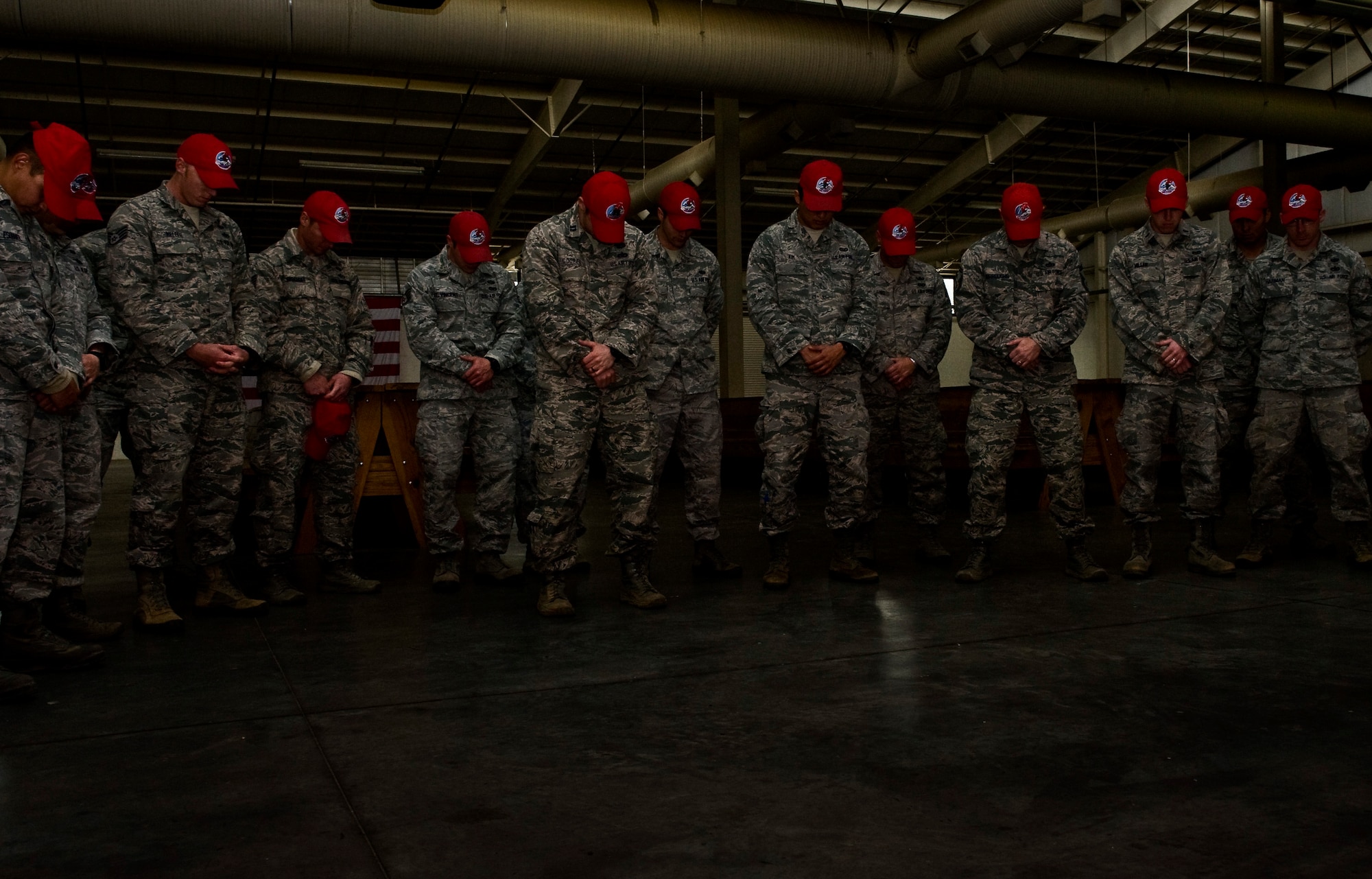 Airmen from the 820th RED HORSE Airborne Flight, Nellis Air Force Base, Nev., have a moment of silence March 1, 2013, at Fort Bragg, N.C., for Retired U.S. Air Force Brig. General William T. Meredith, who passed away earlier in the week. Meredith was instrumental in the creation of RED HORSE squadrons in the Air Force. (U.S. Air Force photo by Senior Airman Daniel Hughes)
