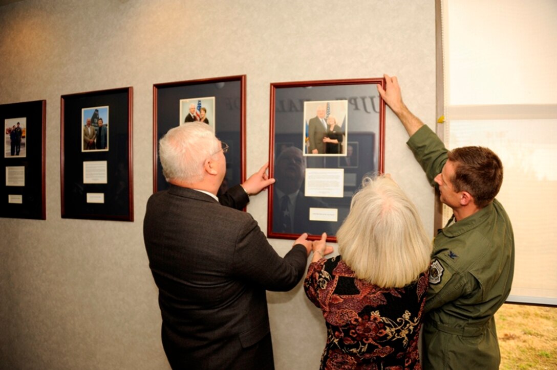 From left to right: Col. (Ret) Dennis Marquardt and his wife Peg (center) with Col. Dieter Bareihs hang the Marquardt's picture on the Euro-NATO Jet Pilot Training Program Hall of Fame wall at Sheppard Air Force Base, Texas on March 5, 2013. The Marquardt's are the 18th inductees into the ENJPPT Hall of Fame. (U.S. Air Force photo/Danny Webb)

