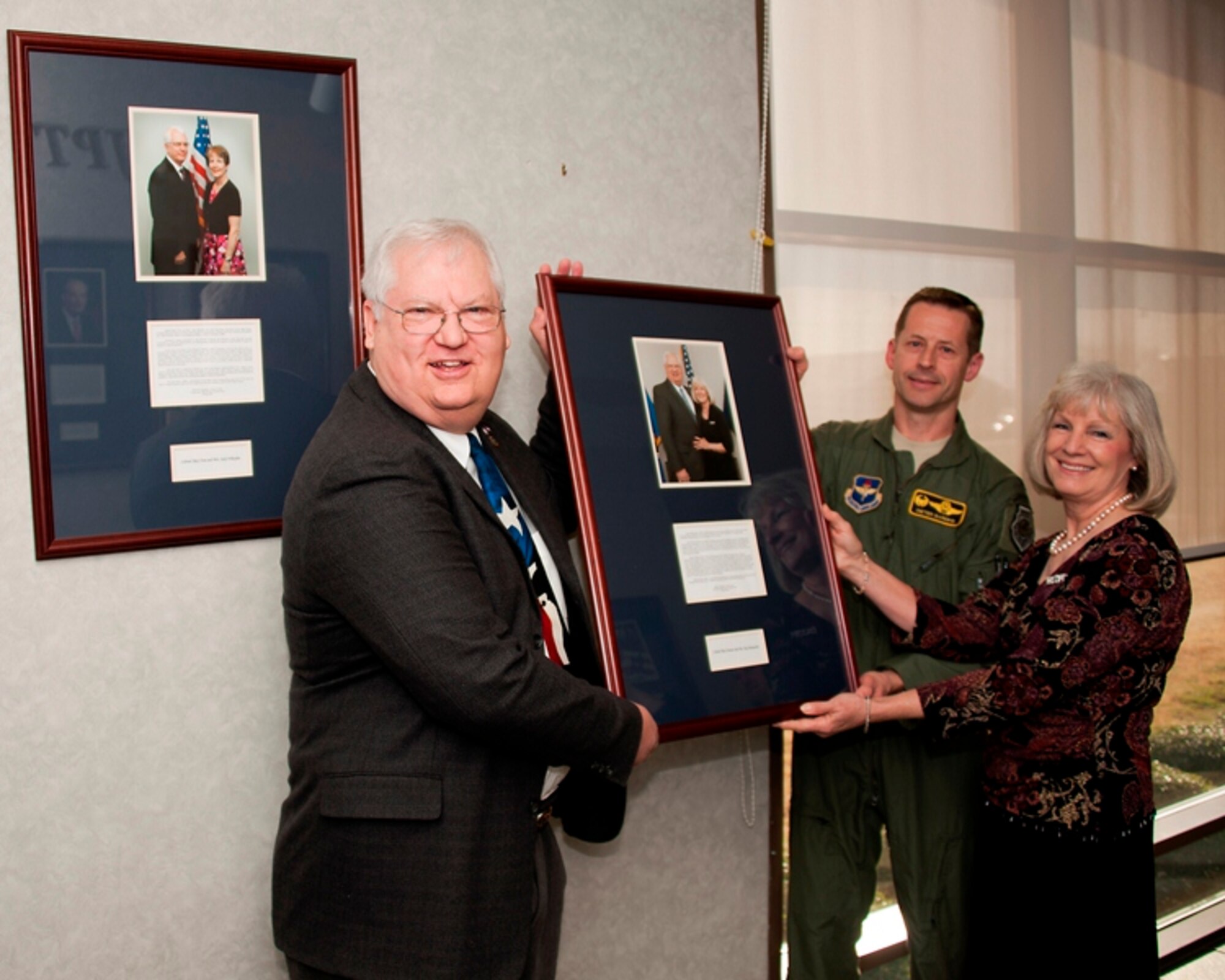 From left to right: Col. (Ret) Dennis Marquardt and his wife Peg (center) with Col. Dieter Bareihs prior to hanging the Marquardt's picture on the Euro-NATO Jet Pilot Training Program Hall of Fame wall at Sheppard Air Force Base, Texas on March 5, 2013.  The Marquardt's are the 18th inductees into the ENJPPT Hall of Fame. (U.S. Air Force photo/Danny Webb)