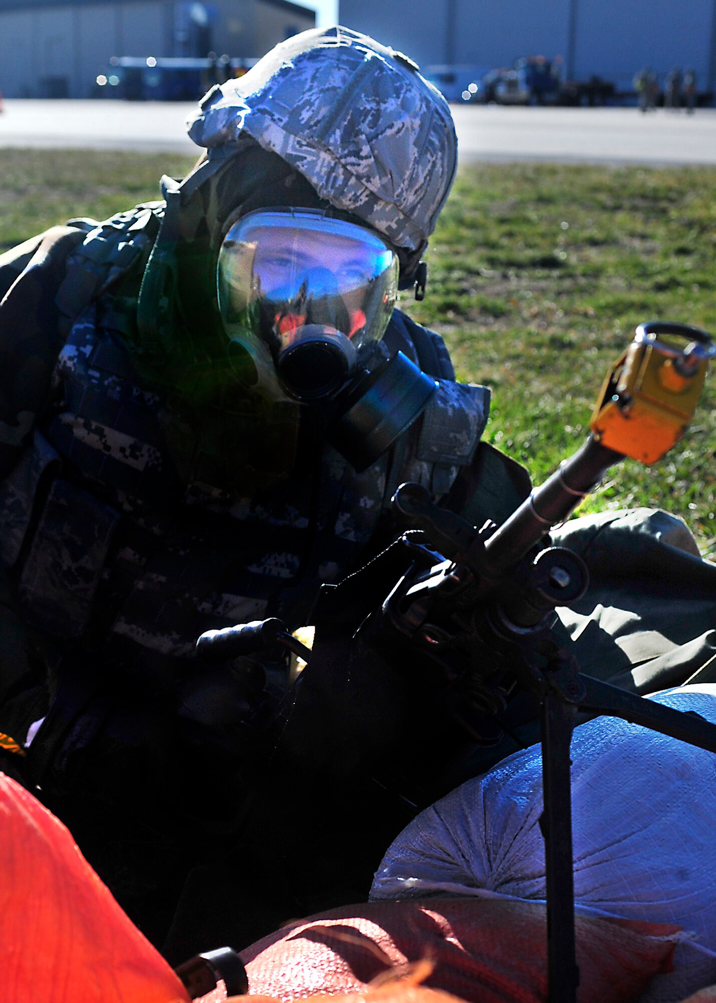 Airman 1st Class Donald Peal, 436th Security Forces Squadron, stands guard at a defensive fighting position following a simulated attack Mar. 4, 2013, at Dover Air Force Base, Del. Peal and other Airmen of the 436th and 512th Airlift Wings participated in an Operational Readiness Exercise Mar. 2 thourgh Mar. 8. (U.S. Air Force photo/Tech. Sgt. Chuck Walker)