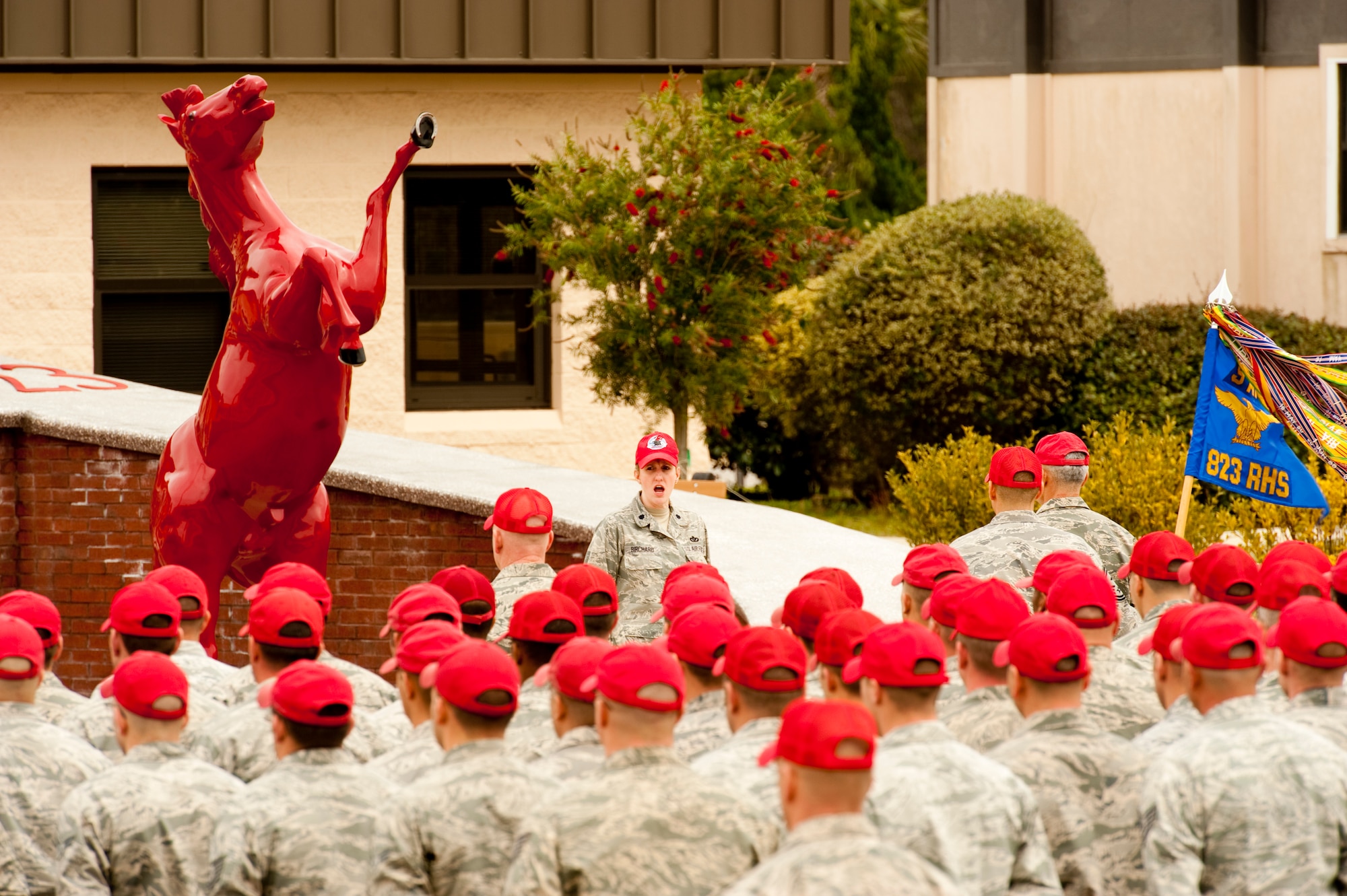 Lt. Col. Ann Birchard, commander of 823rd RED HORSE Squadron, addresses the Airmen of the squadron about recently passed retired Brig. Gen. William Thomas Meredith.  Meredith retired in 1973 and established Air Force organizations such as RED HORSE.  (U.S. Air Force photo by Airman 1st Class Benjamin D. Kim)
