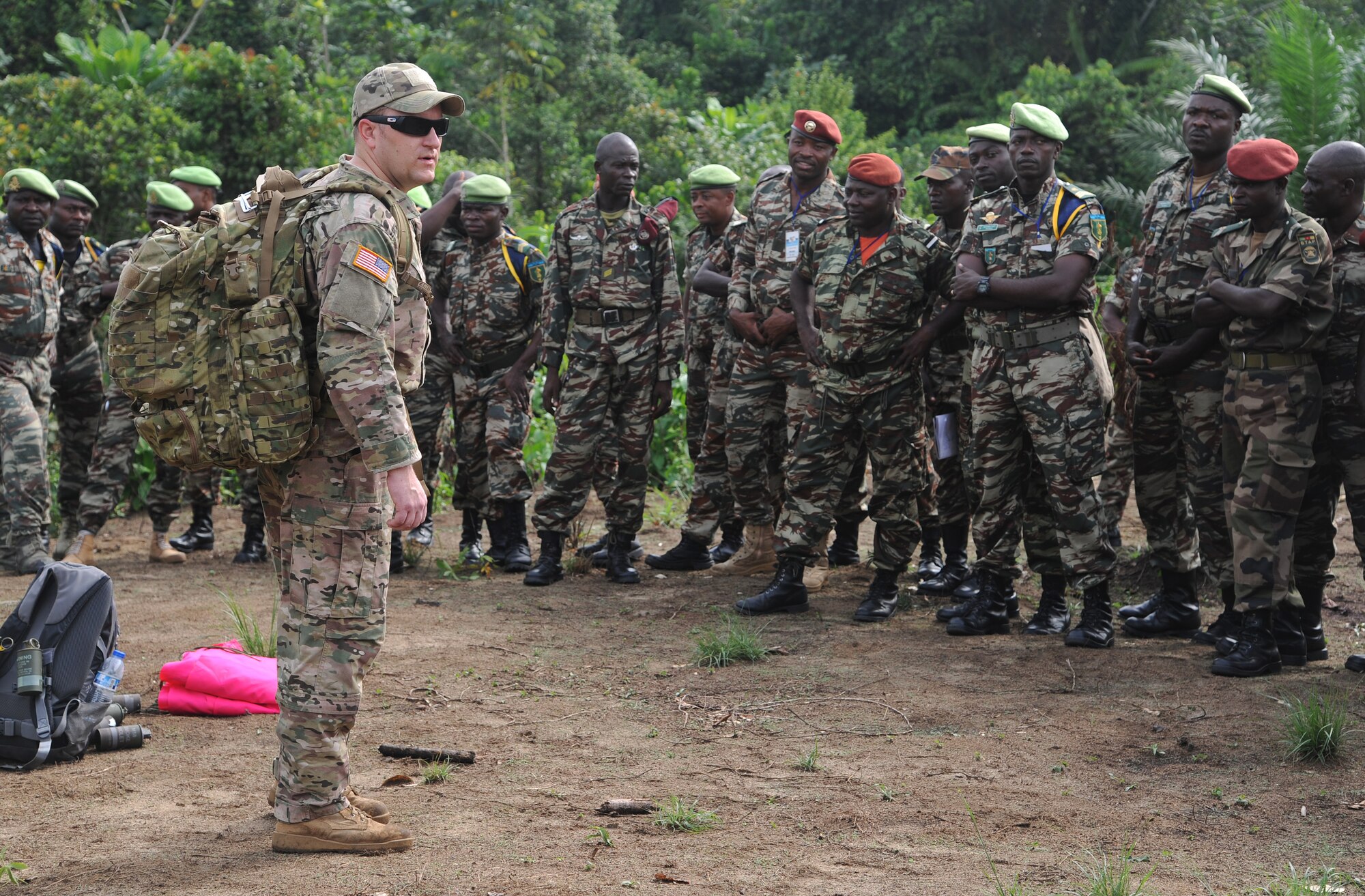 DOUALA, CAMEROON – U.S. Army Staff Sgt. Nick Pence, a pathfinder member assigned to the 560th Battlefield Surveillance Brigade, Atlanta, GA, prepares to assists a Cameroon Defense Forces members with setting up an aerial delivery drop zone marker prior to a Cameroon Air Force C-130 low-cost low-altitude bundle air drop during Central Accord 2013, at the Cameroon Defense Forces Engineer Base, Douala, Cameroon, February 27, 2013. Pence is participating in Central Accord 2013, a joint exercise in which U.S., Cameroon and neighboring Central African militaries partner to promote regional cooperation while and increasing aerial resupply and medical readiness capacity. (Photo by Master Sgt. MSgt Stan Parker, 621st CRW Public Affairs)